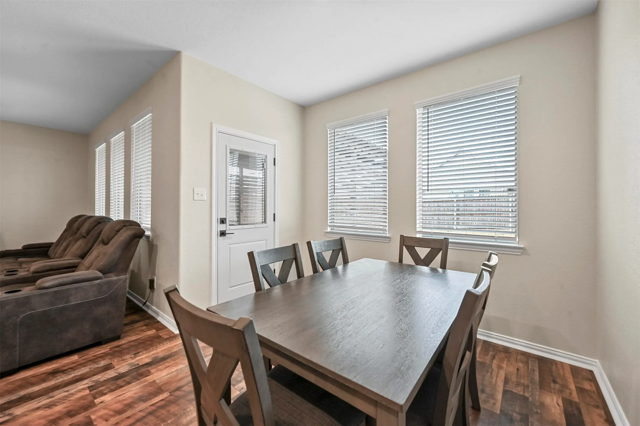 Dining area featuring a wealth of natural light and dark hardwood / wood-style flooring