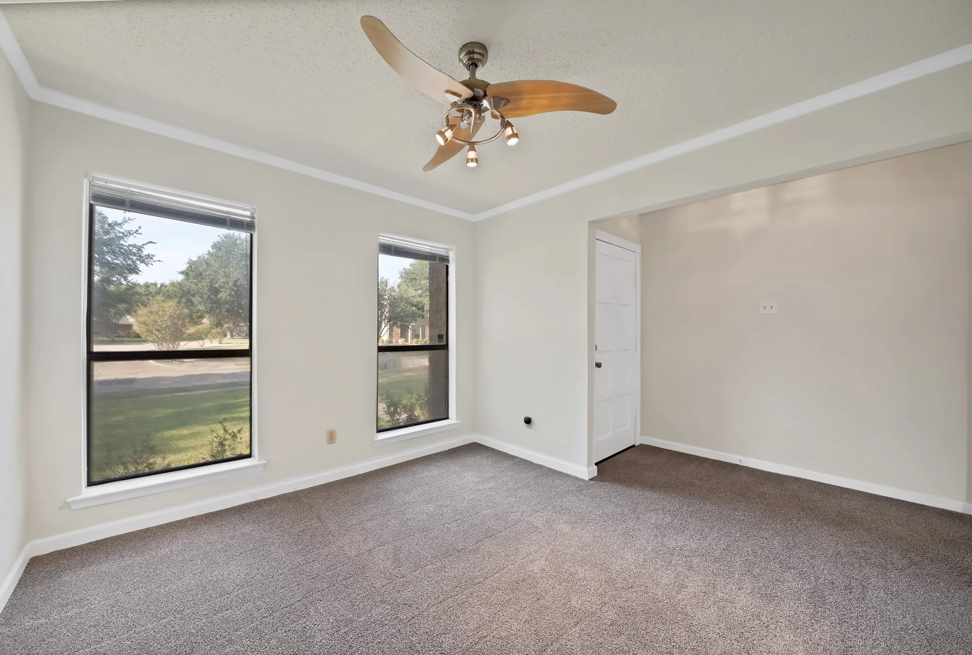 Recessed lighting with a ceiling fan, dual windows, and carpet flooring