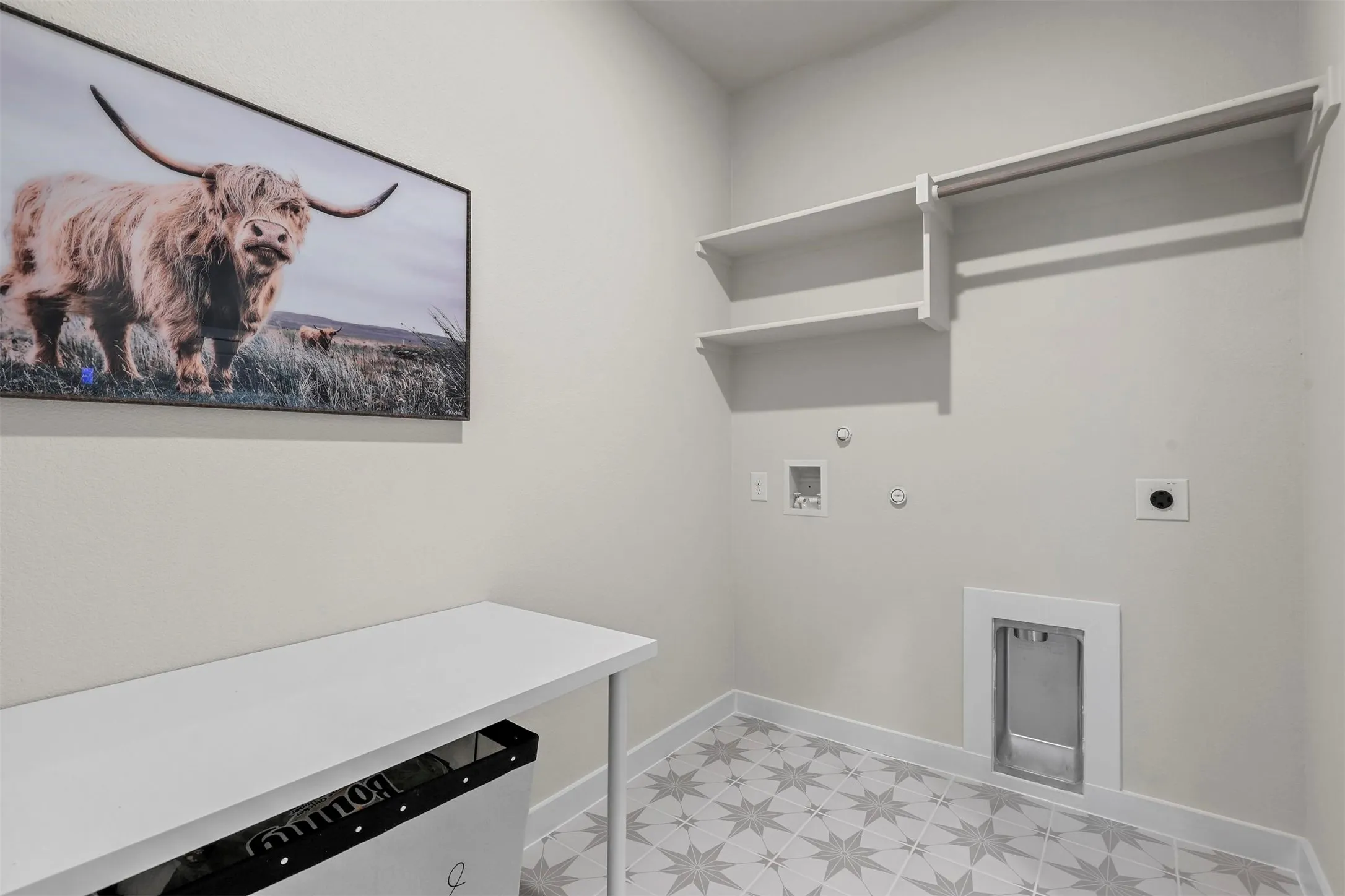 Patterned floor tiles, wall-mounted shelving, and a hanging rod