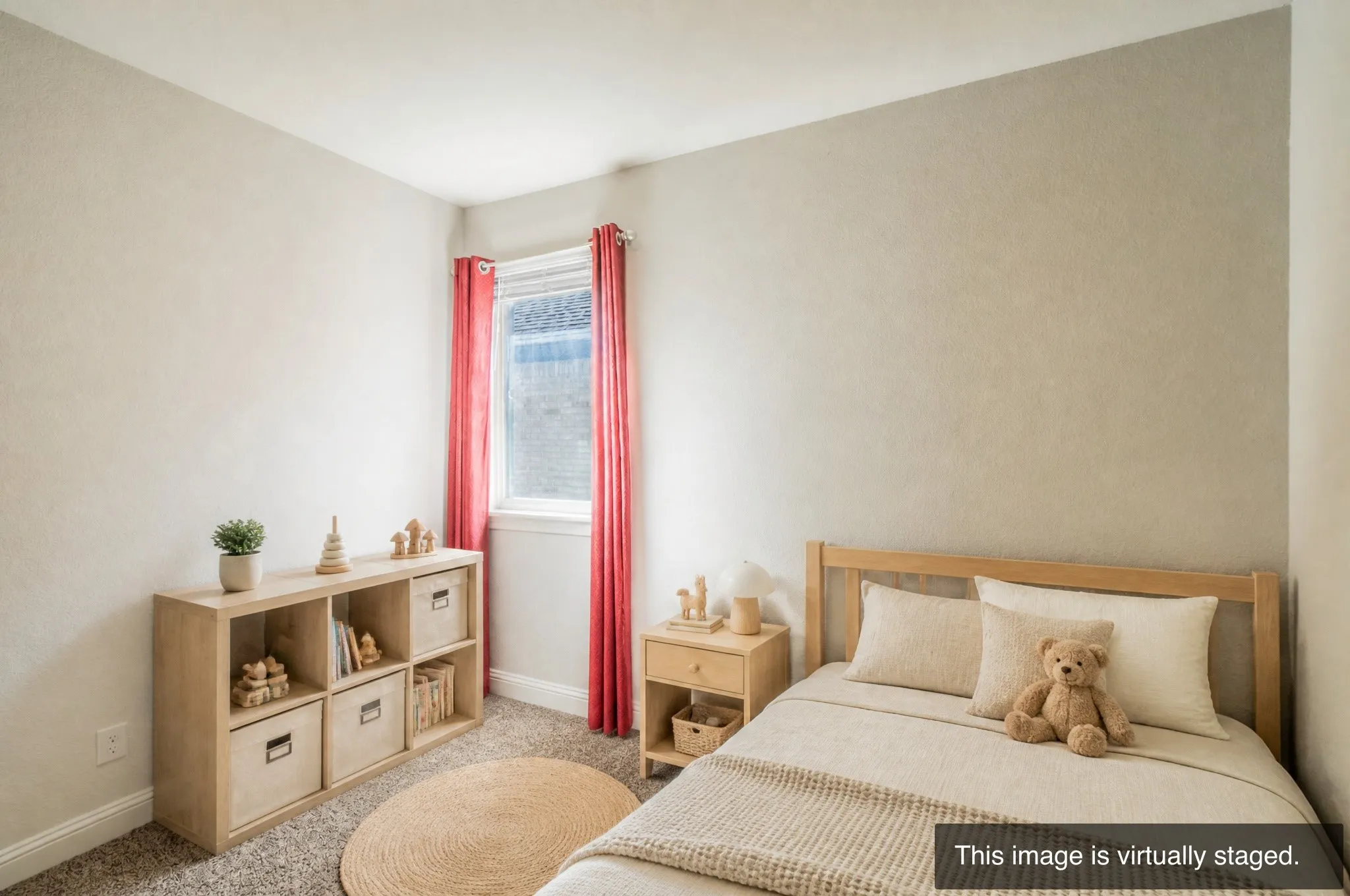 Carpeted room with a single window, featuring a light-toned wooden bed frame and a complementary wooden nightstand
