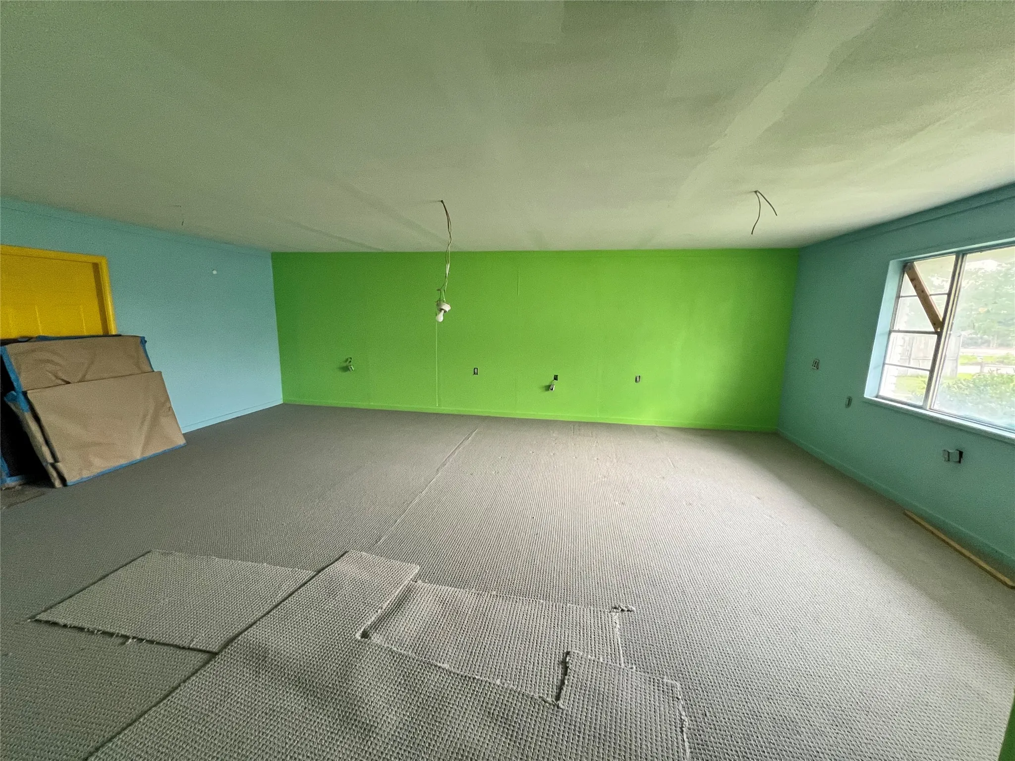 Garage enclosed  room with carpet flooring