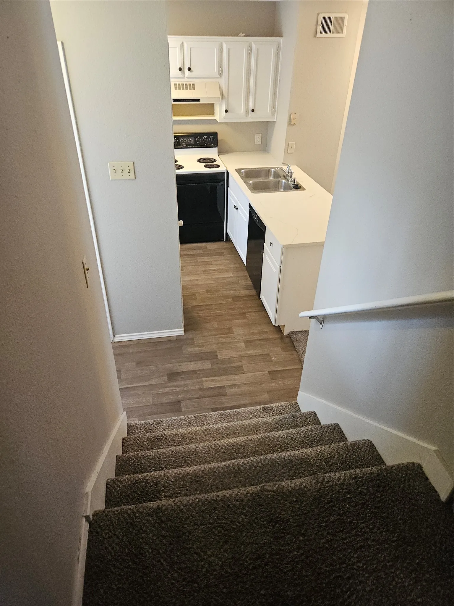 810 - View of kitchen from stair landing.