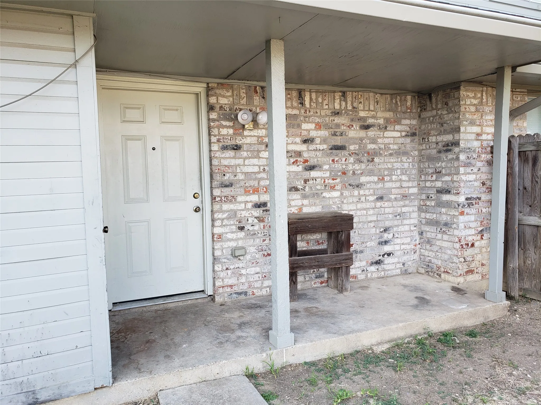 808 - Back covered porch, storage closet to the left.