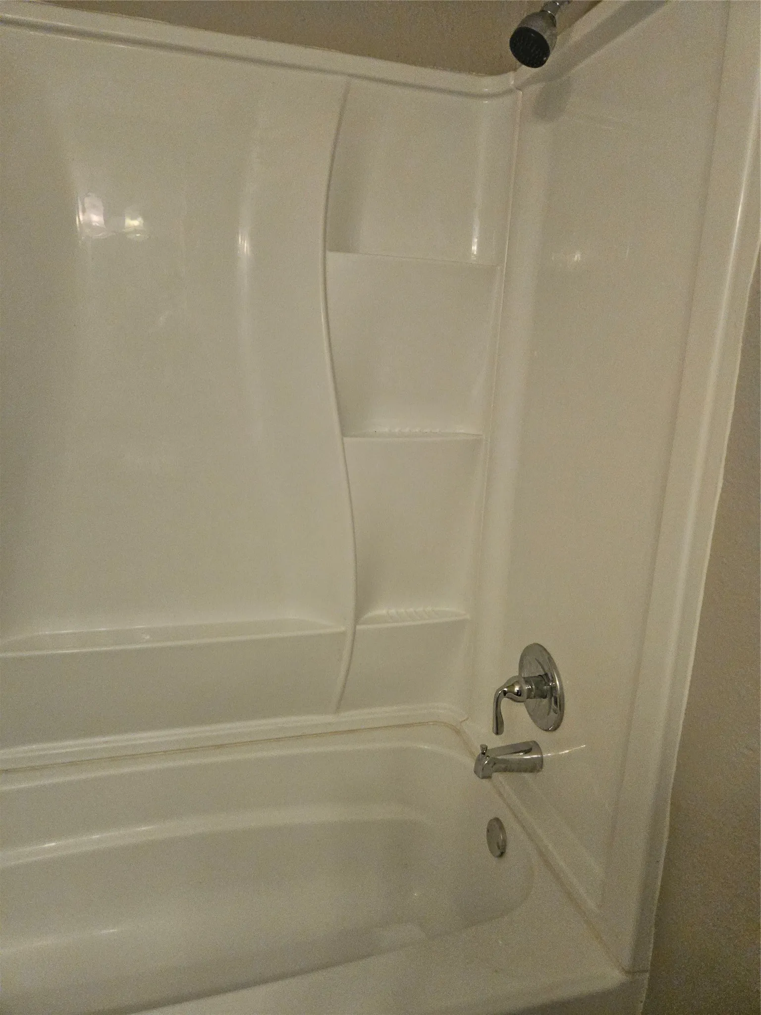 810 - Tub with shower walls.