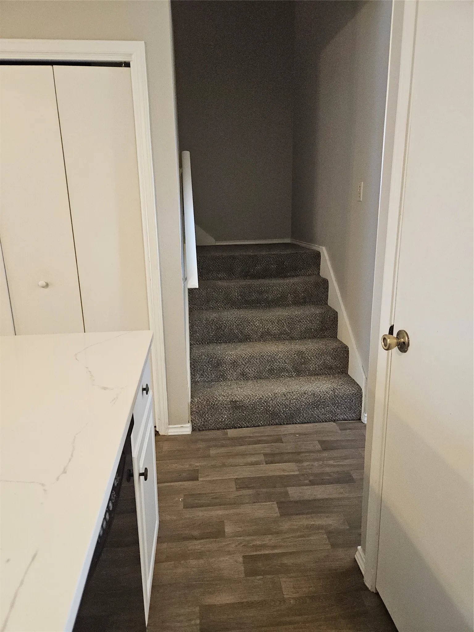 810 - Stairs beside the utility closet.