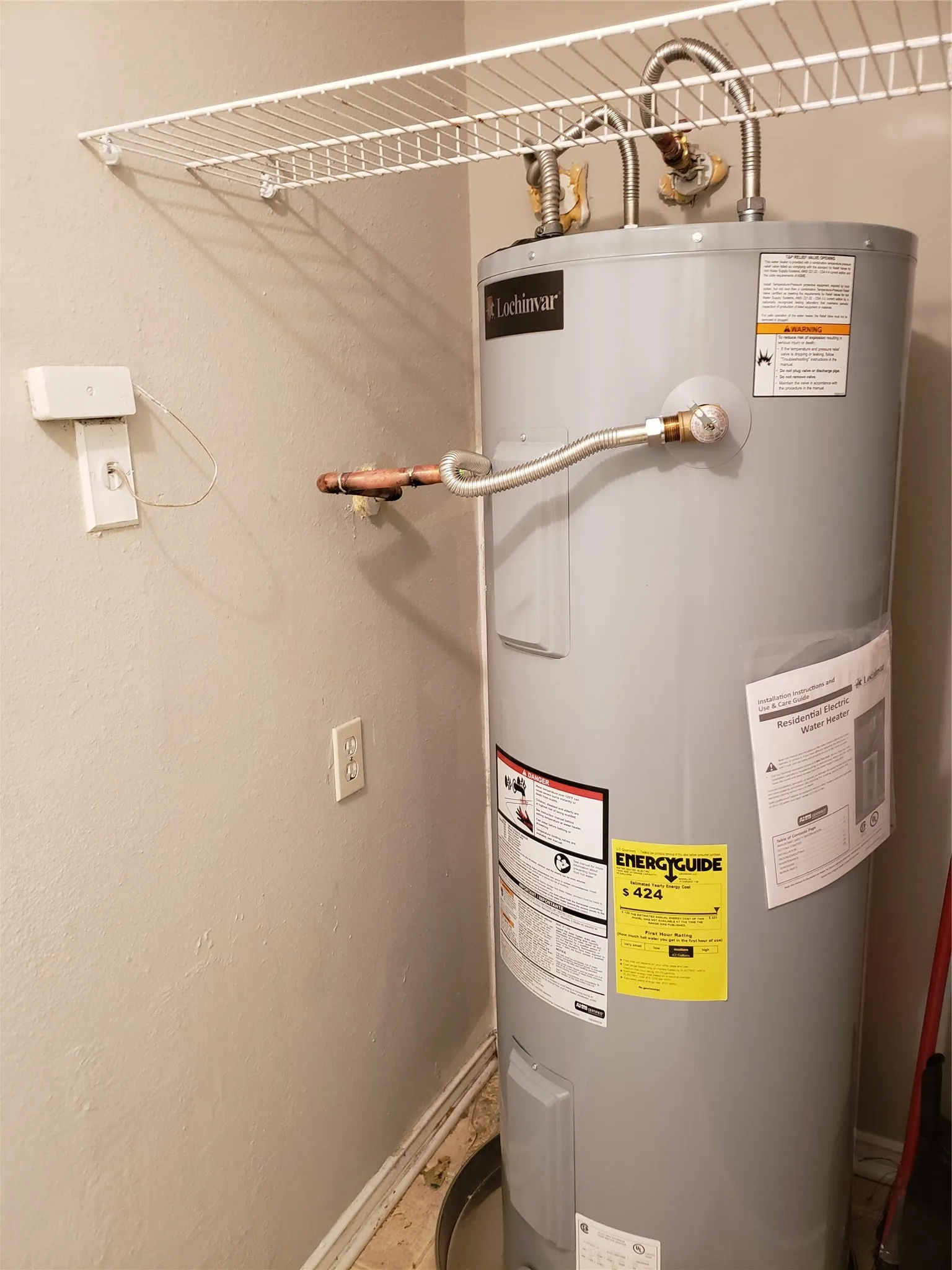 808 - Electric water heater at utility room. Tenant washer to sit in front of water heater.