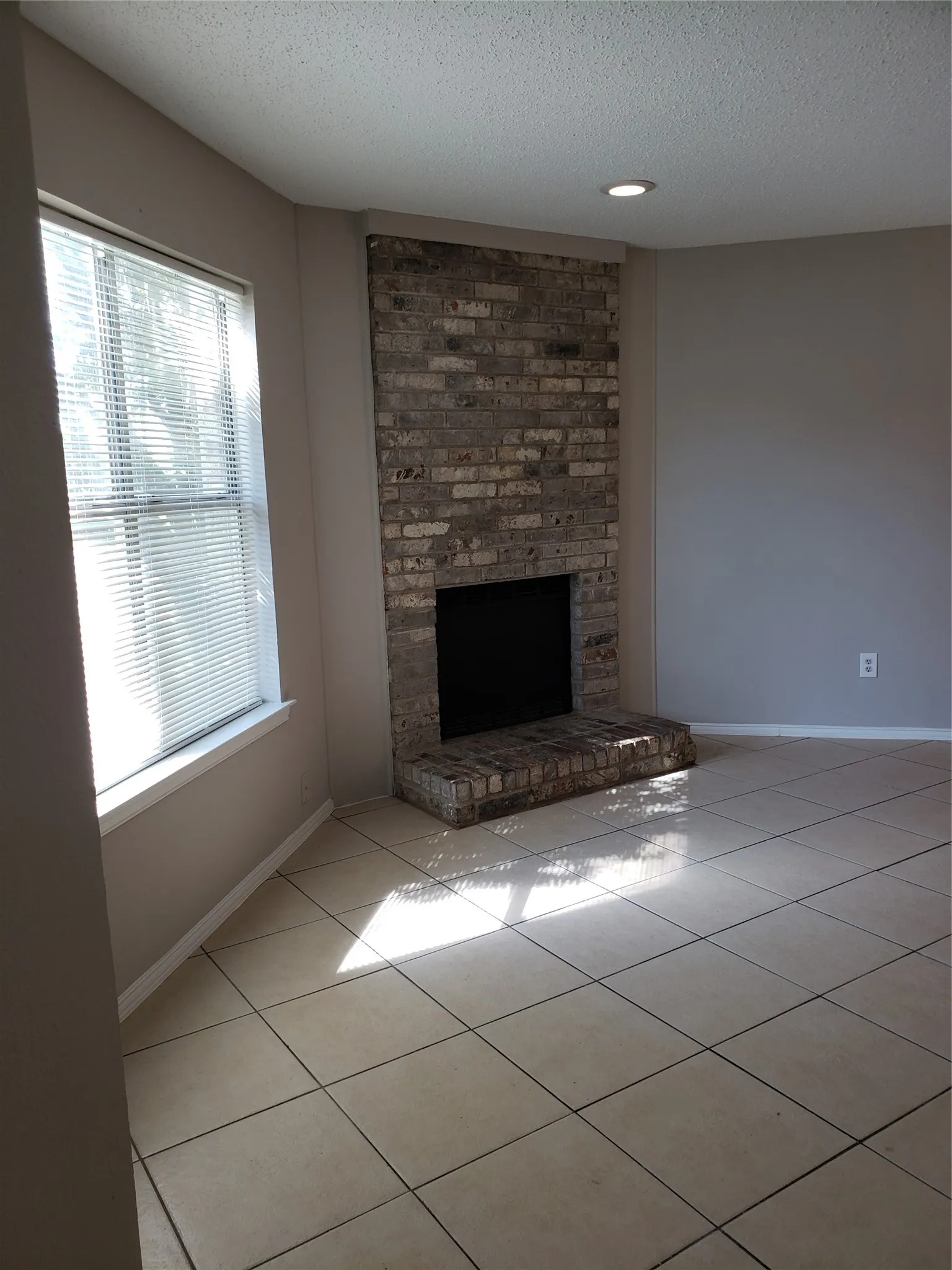 808 - Front window and hearth from entry. (For rentals, the fireplace is covered; simple to uncover.)