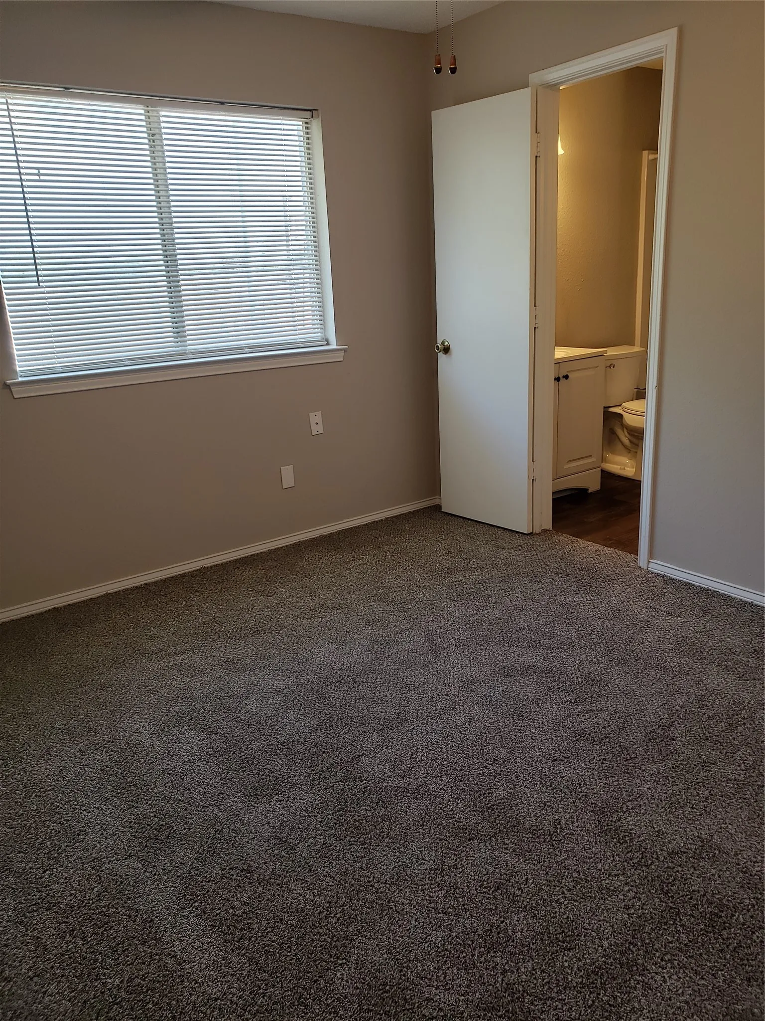 808 - Bedroom with door into shared bathroom.