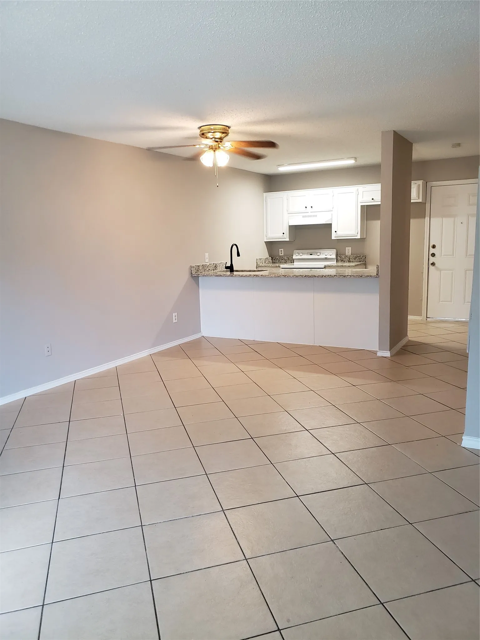 808 - Living, dining, kitchen, and back door.