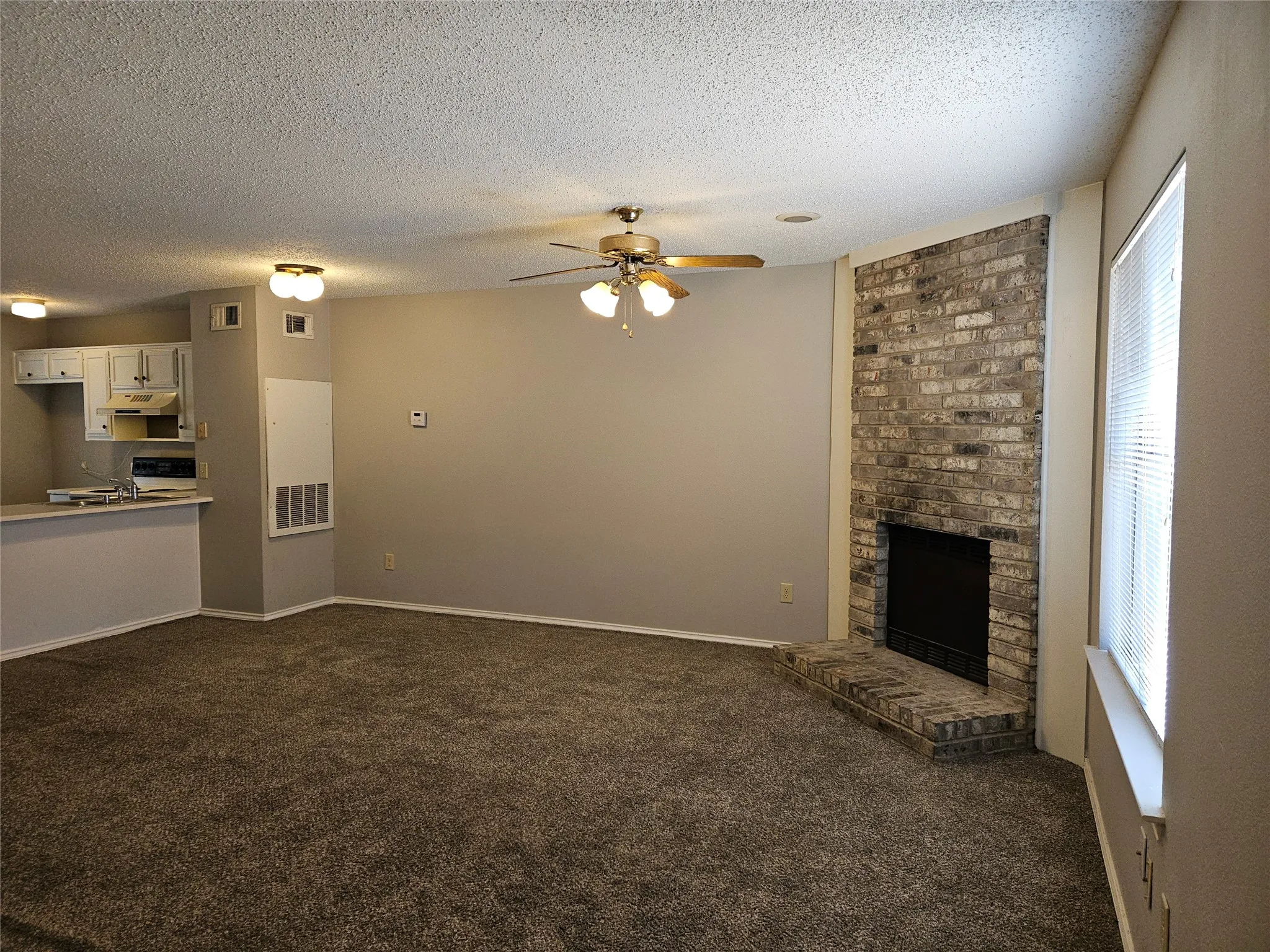 810 - Living and hearth as viewed from front entry (for rentals, fireplace is covered; simple to remove covering.)
