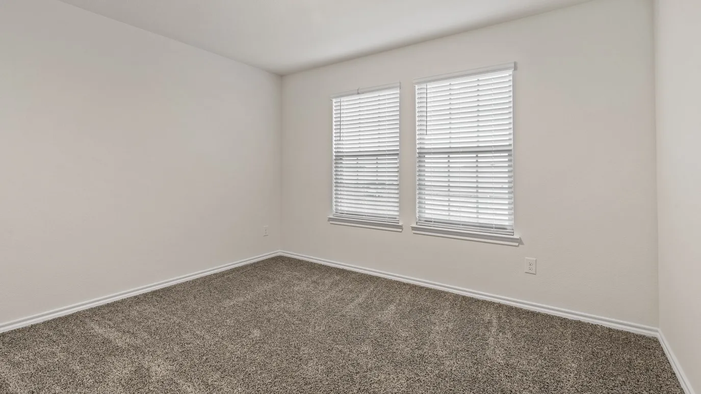 Neutral color palette with carpeted flooring and white trim