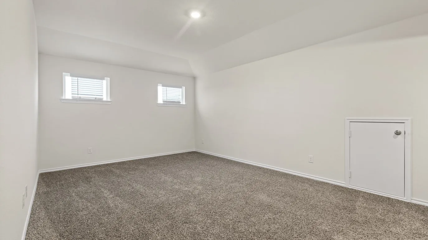 Neutral-toned carpeting, white walls, two windows with blinds, and a built-in access panel