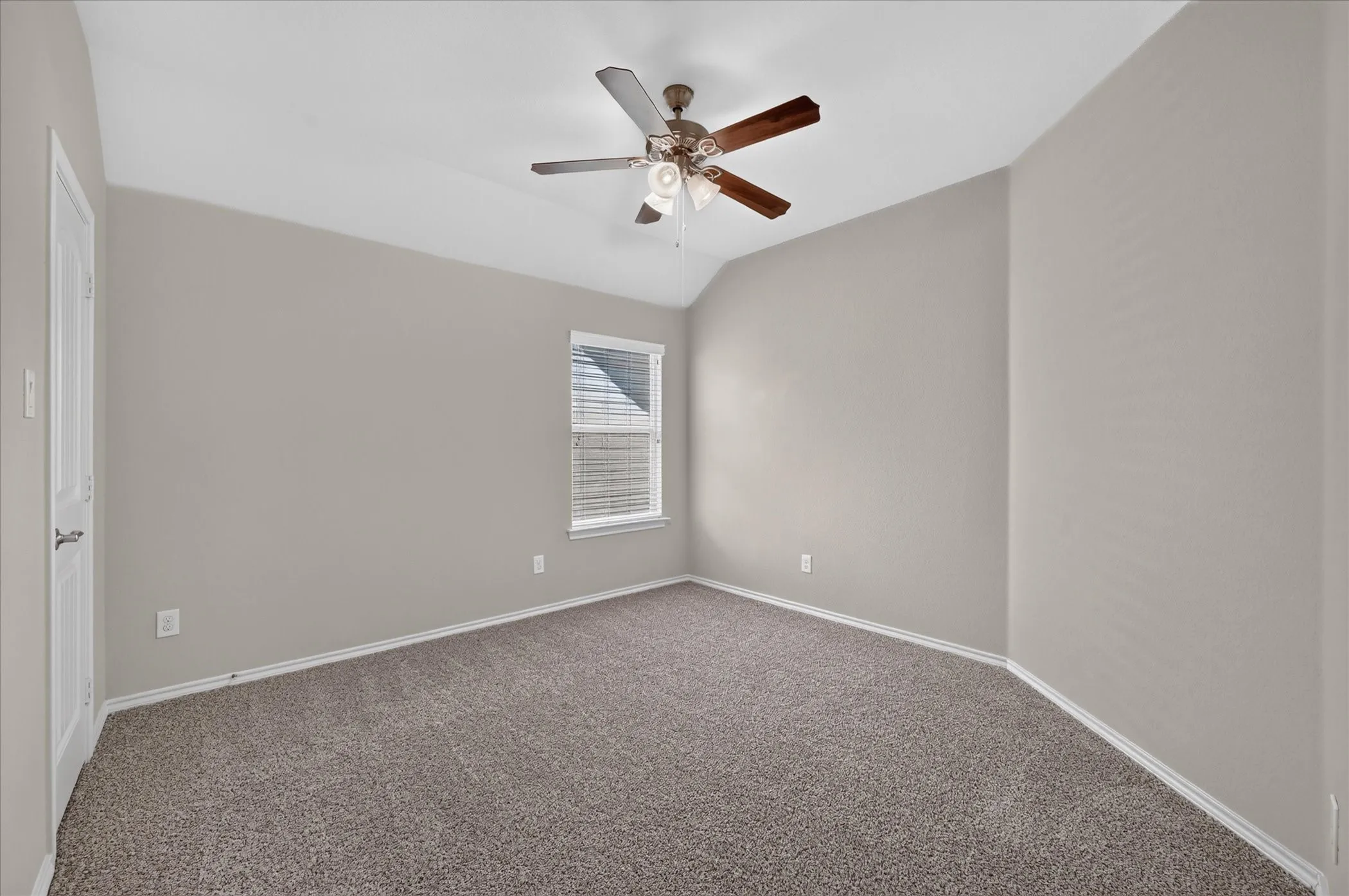 Neutral-toned walls complement a brown carpeted floor