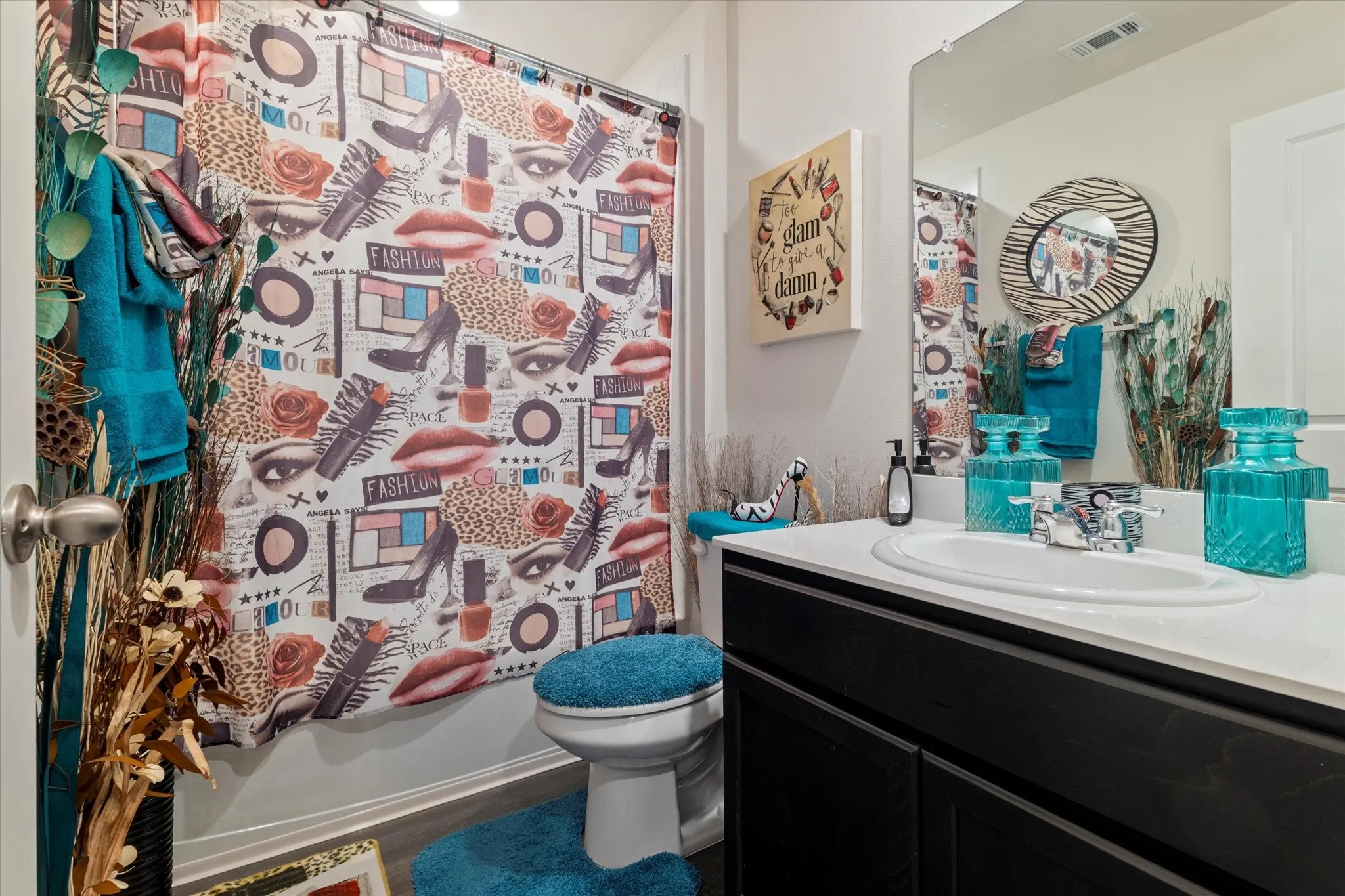 Full bath featuring vanity and shower / bath combo with shower curtain