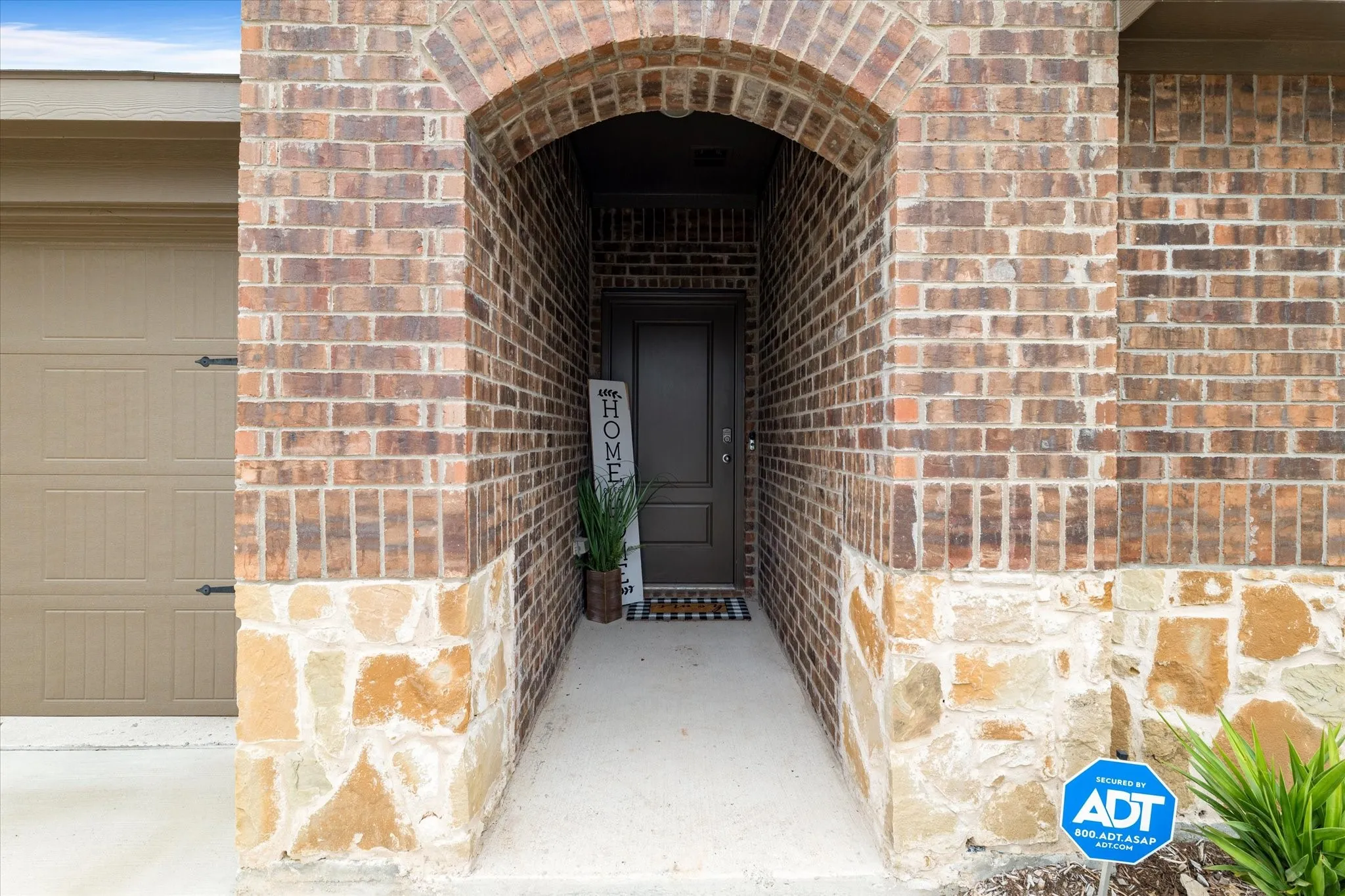 Property entrance with brick siding