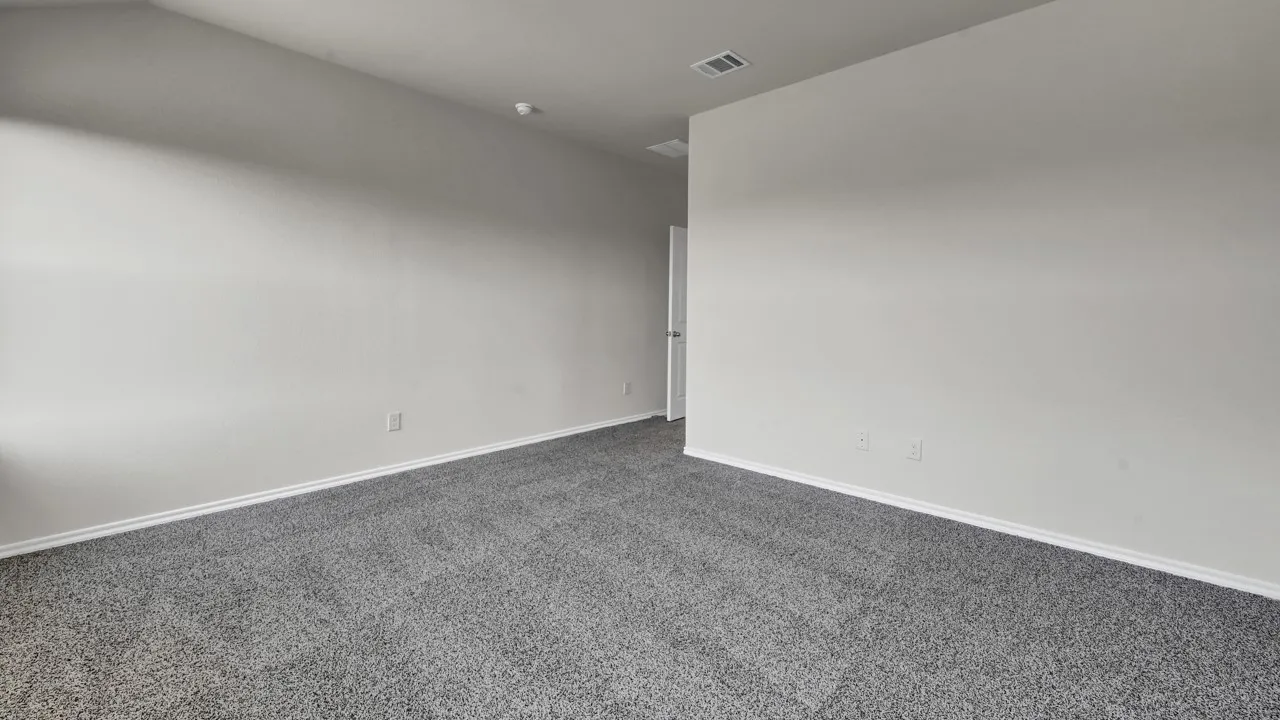 Wall-to-wall carpeting with a neutral finish, light-toned wall paint, and white trim