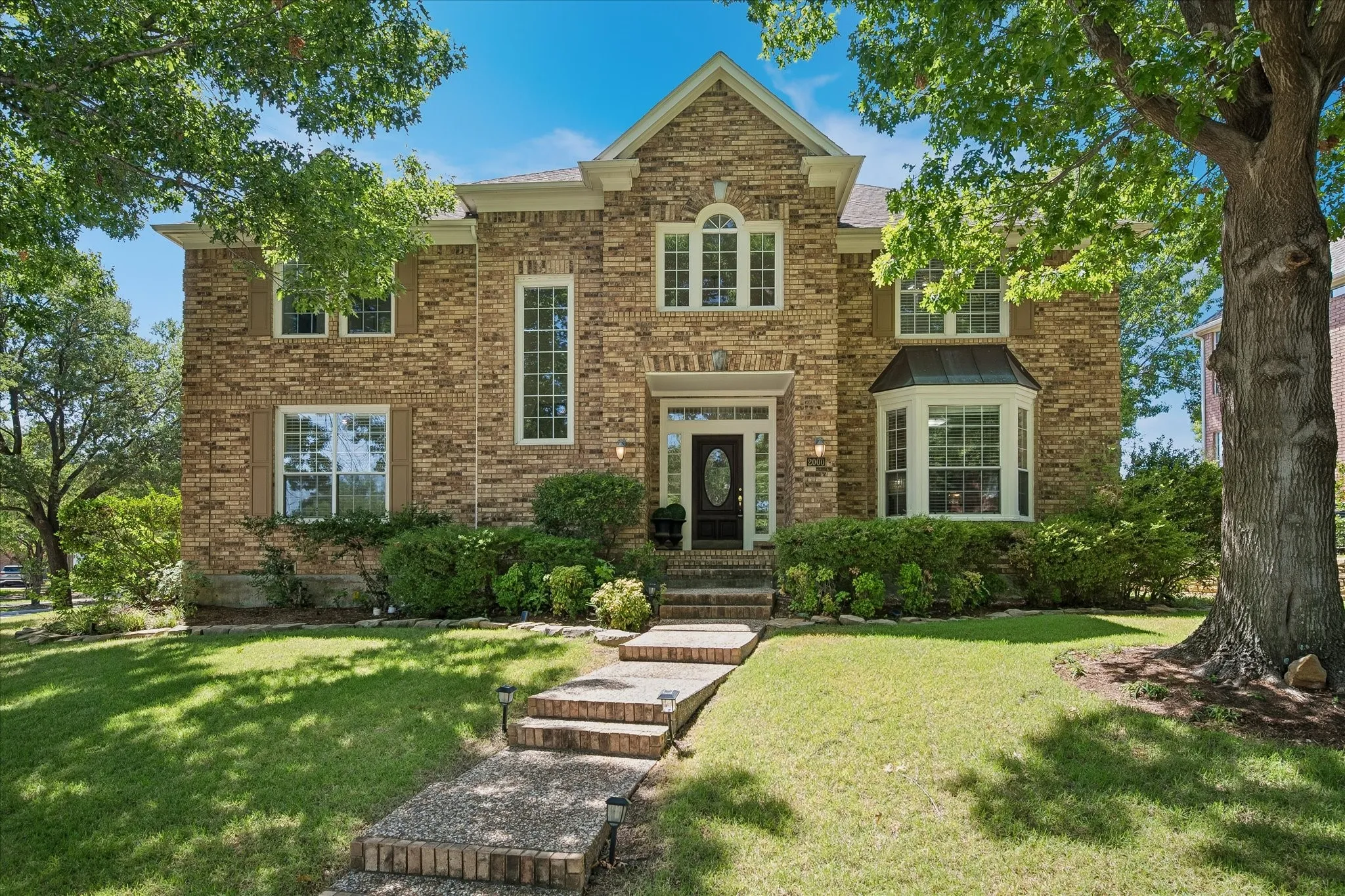 Brick facade with a prominent gabled entry