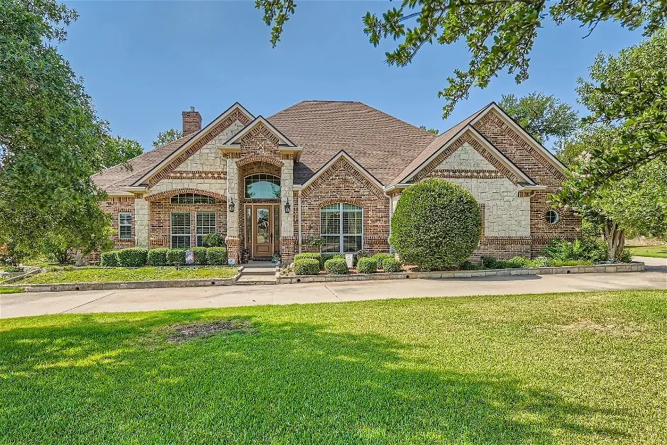 Brick and stone facade with arched entry