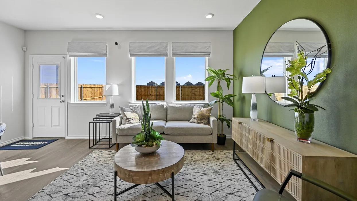 Recessed lighting, wood-finish flooring, multiple windows with blinds, and a paneled door with a glass insert