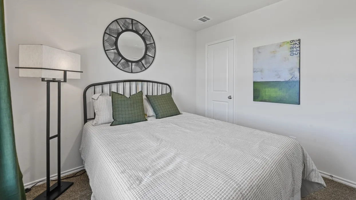 Carpeted flooring, white walls, and a built-in closet with a panel door