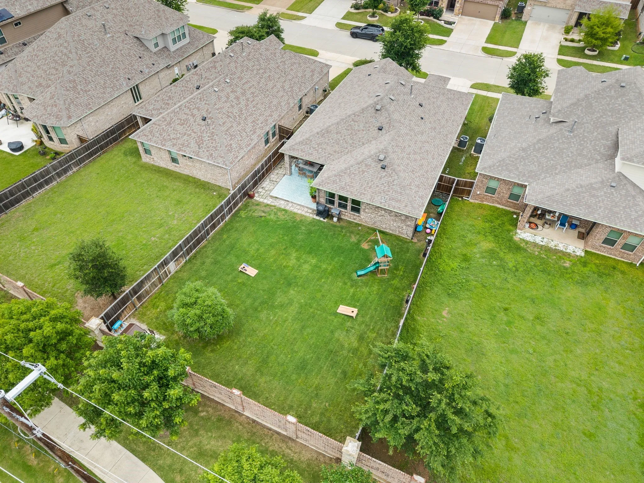 Expansive back yard space with perimeter fencing, established trees, and a wonderful size patio...You ca see how great this backyard is and just gives you the idea of what you can do with it...Pool maybe?