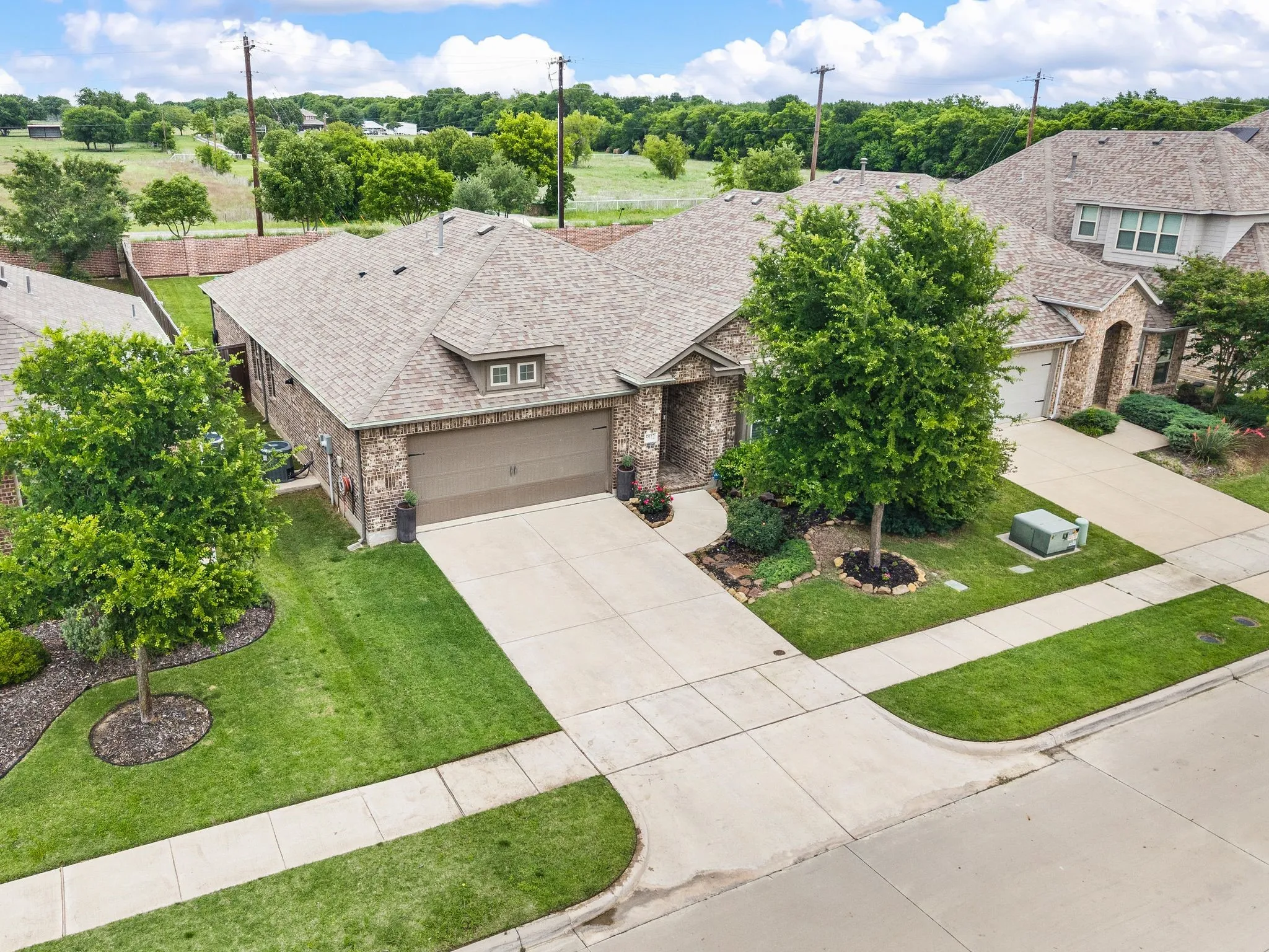 Brick exterior, attached two-car garage, concrete driveway, and established landscaping....Fabulous place to call HOME!