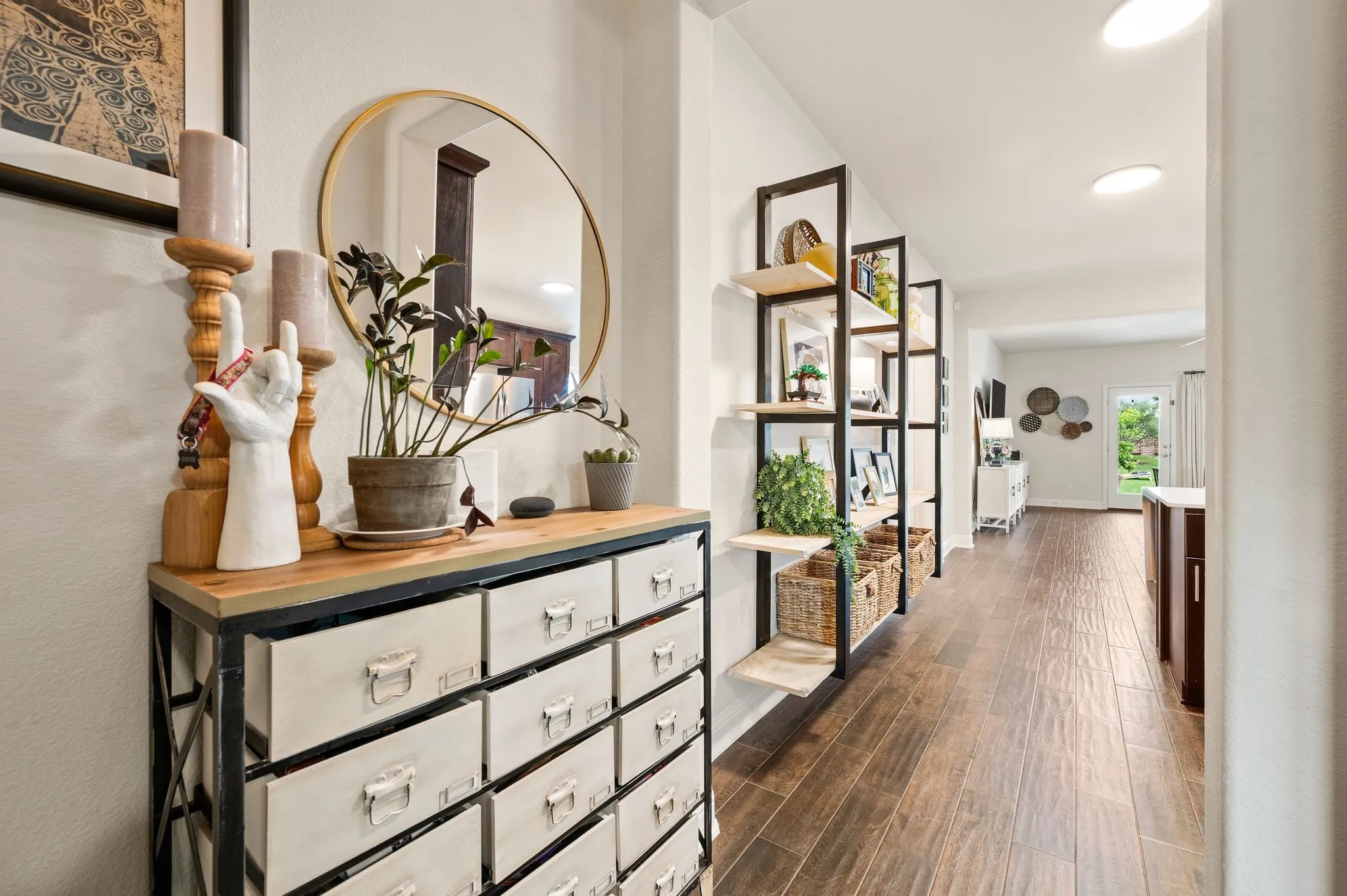 The view down the hallway....it is a right and lovely with natural light.  The built in custom shelves will stay with the home!