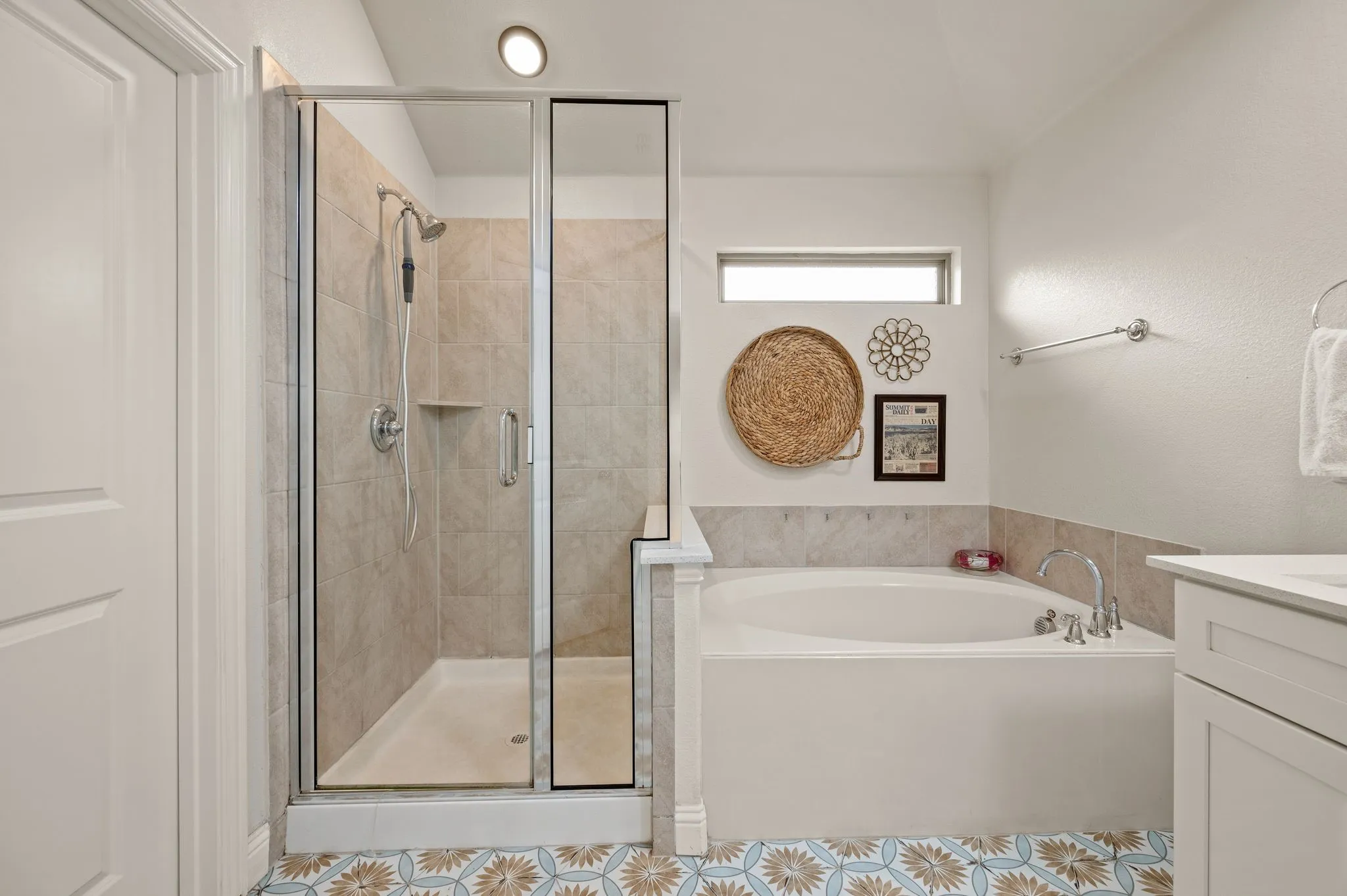 Private spa like primary bathroom with glass-enclosed separate shower and garden bathtub, updated fabulous tile flooring  and a bidet on the toilet...
