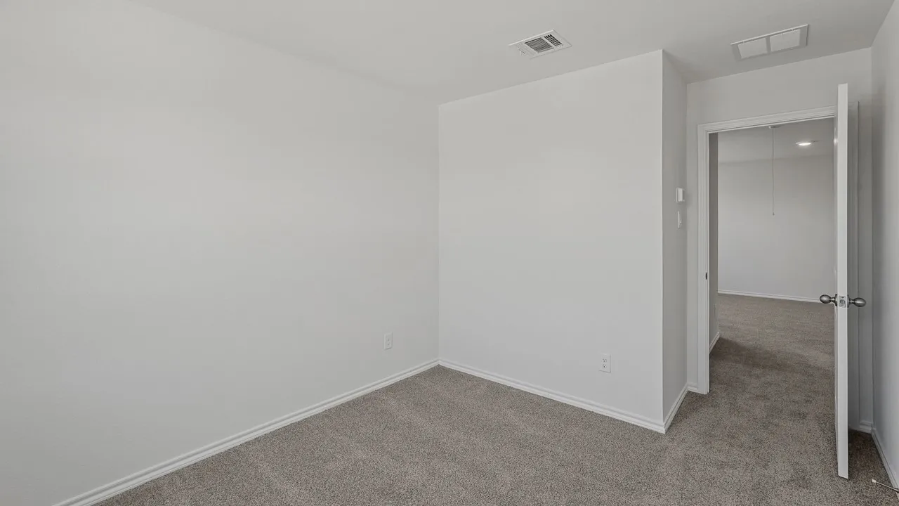 Neutral wall color, carpeted flooring, and white trim