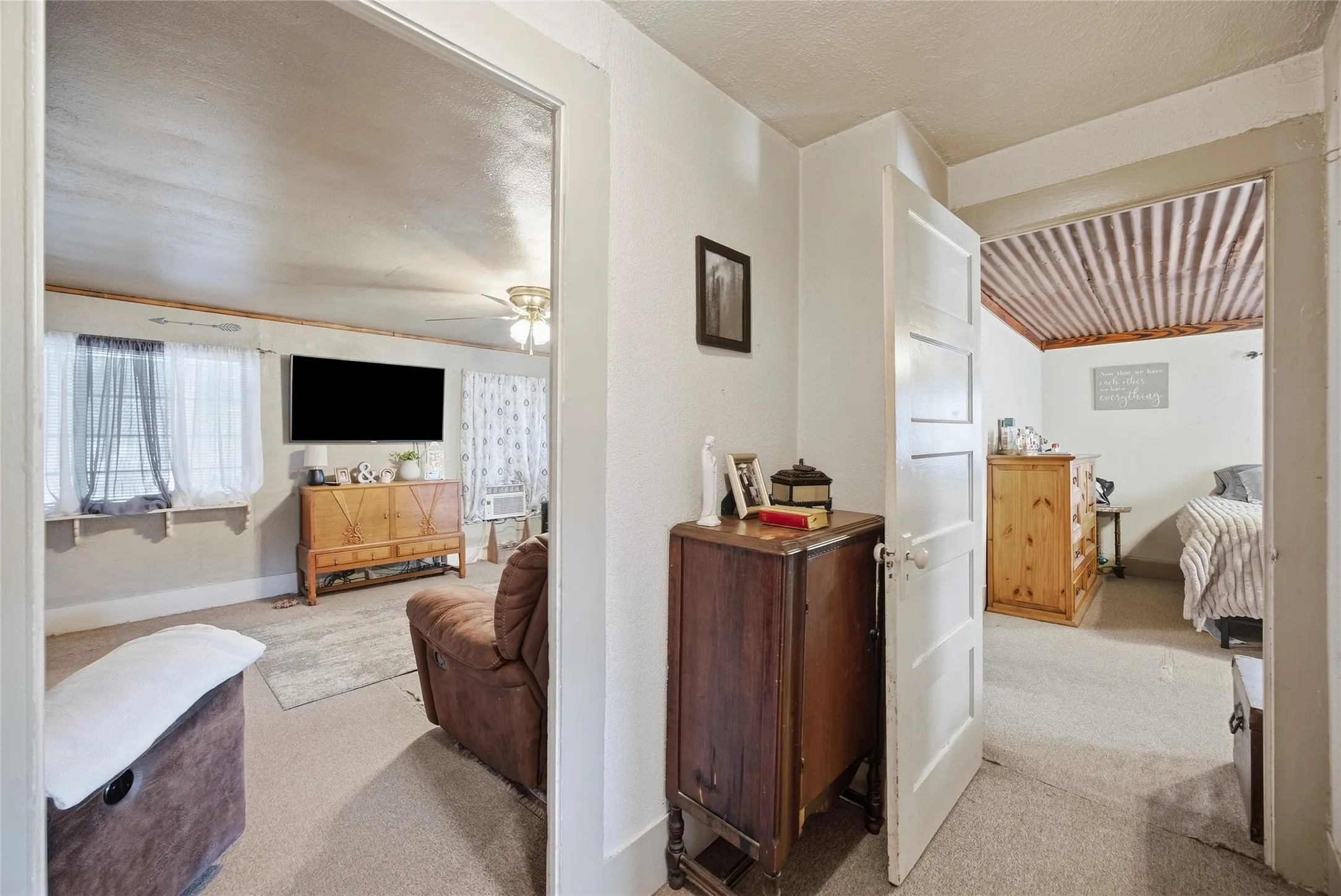 White interior doors, neutral wall colors, and wall-to-wall carpeting
