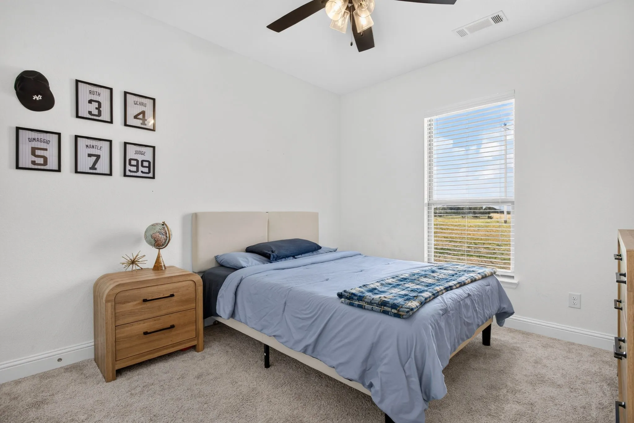 Both with ceiling fans and views of the farmland across the street.