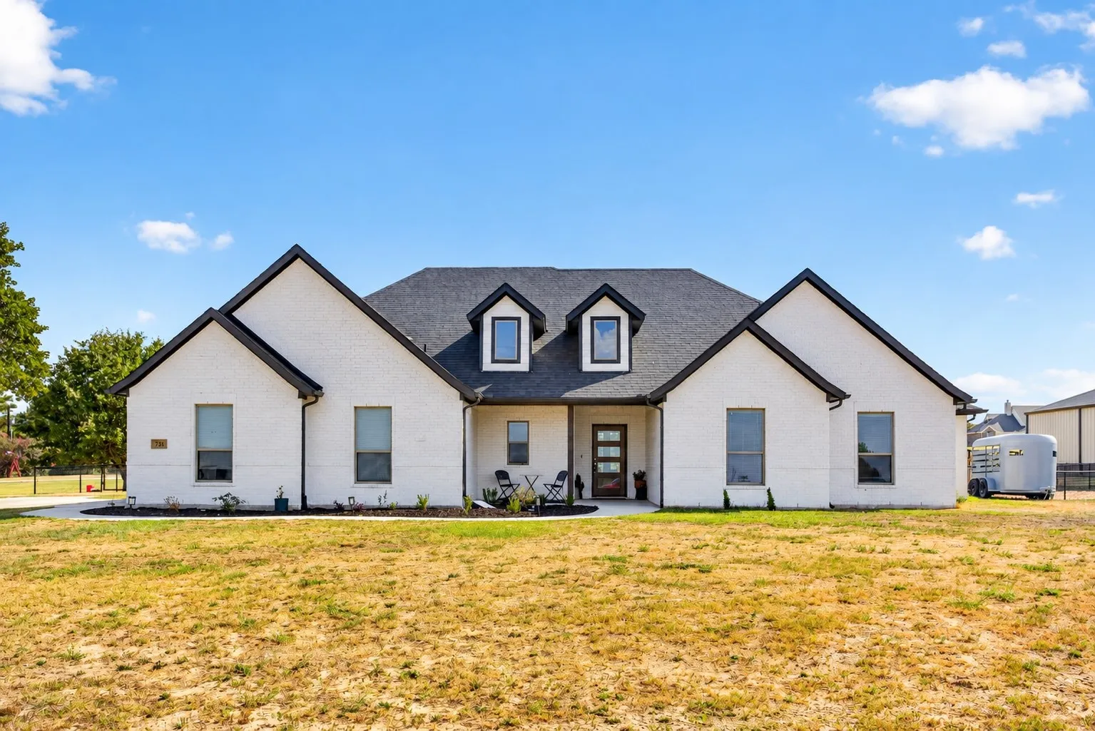 Like-new construction built in 2022; easy, breezy curb appeal.