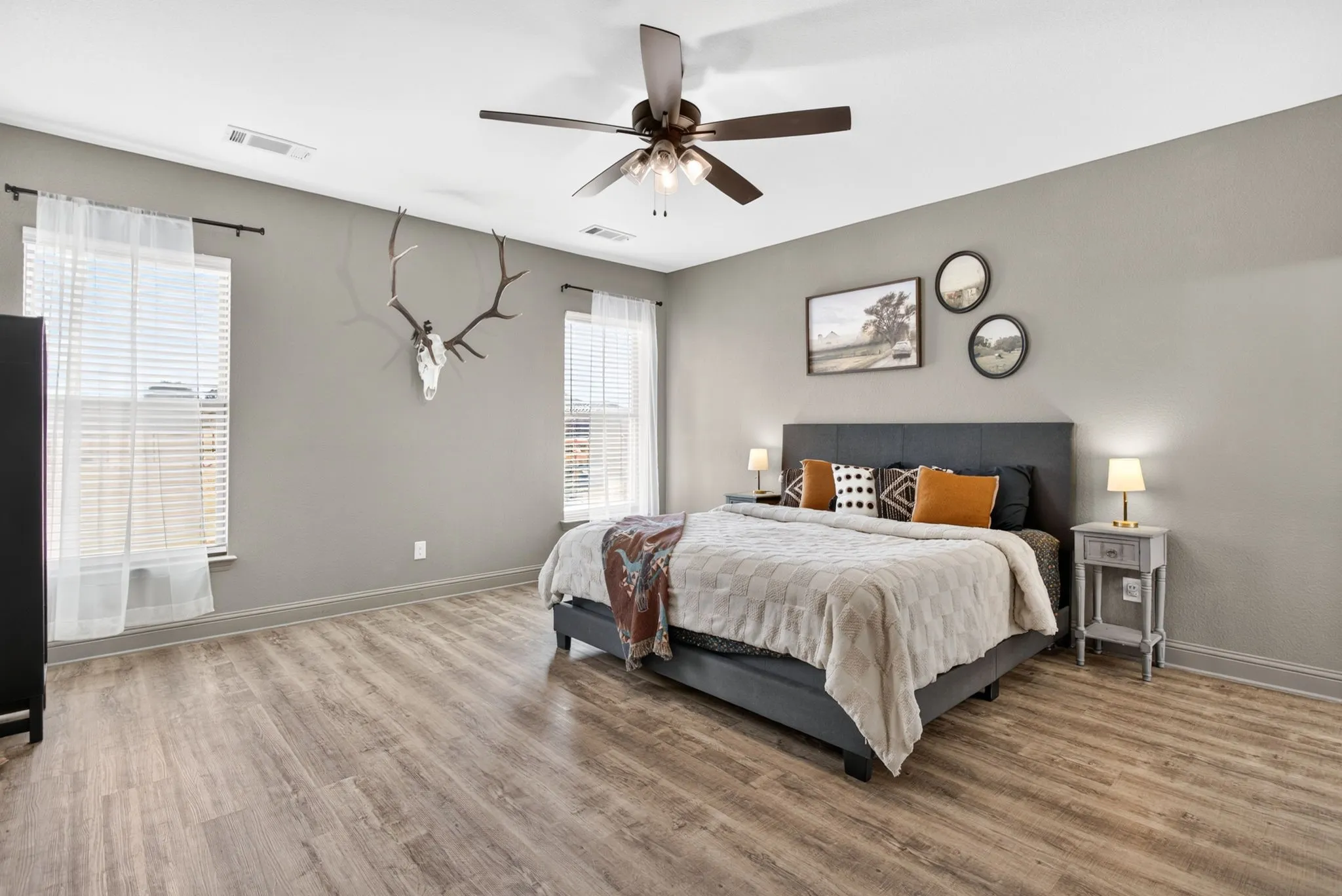 Once again - another surprisingly spacious room. The primary enjoys hard flooring and views to the backyard.