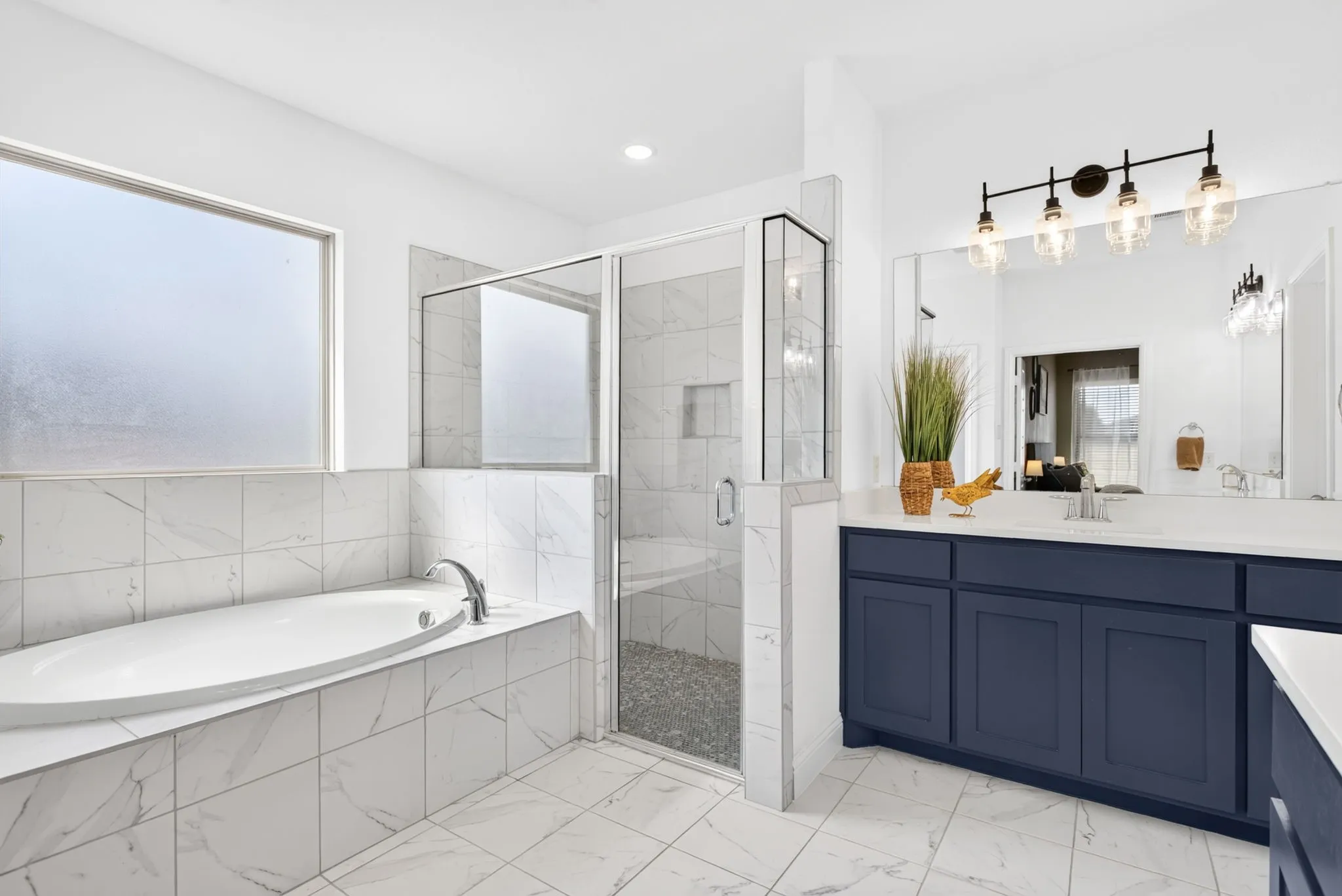 Soaking tub and big walk-in shower. Love the square set tile - keeping things clean and fresh.