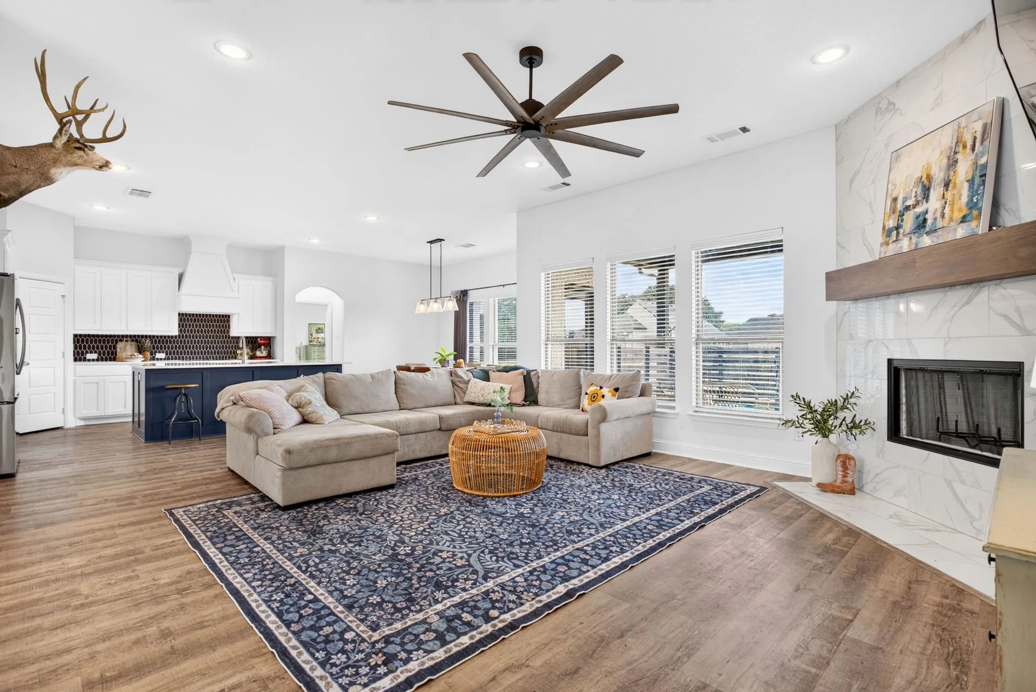 Love the big fan and the windows facing the backyard.
