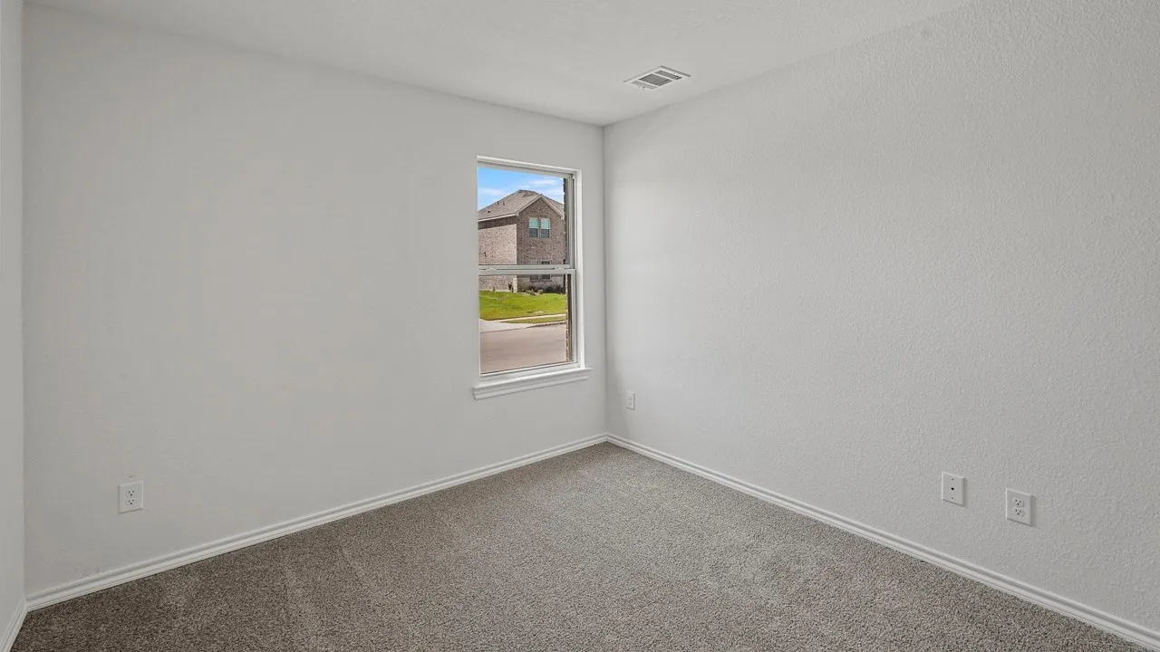 Recessed ceiling light, neutral wall color, window with exterior light, carpeted flooring, white trim