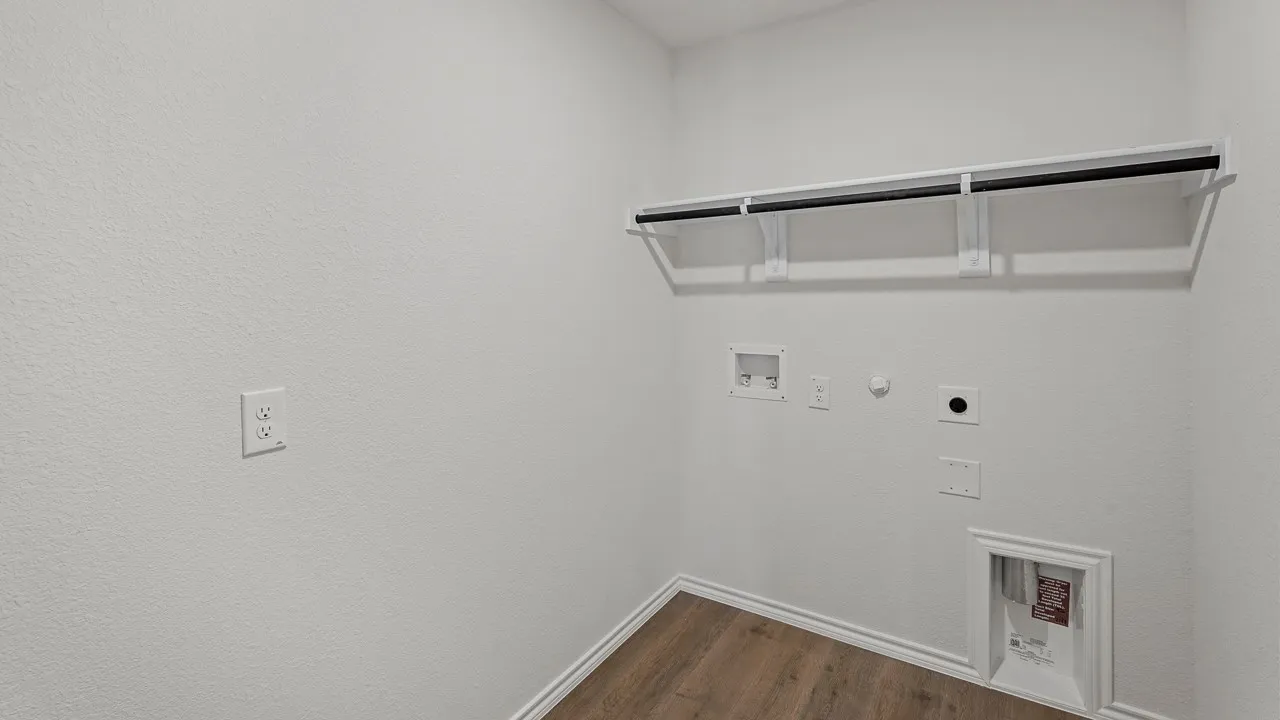 Wood-finish flooring with white baseboards