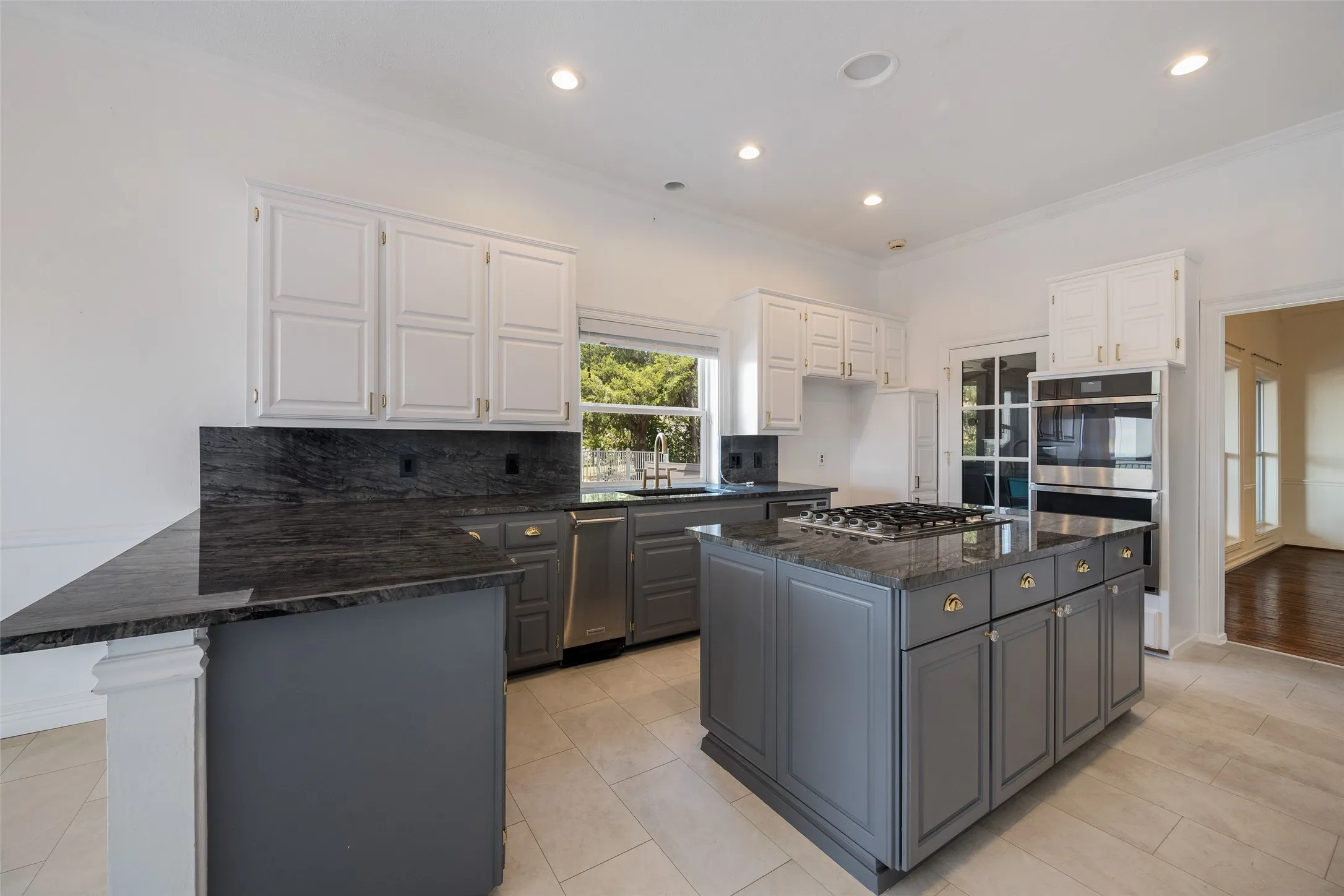 Island kitchen with Quartzite countertops, features lakeviews