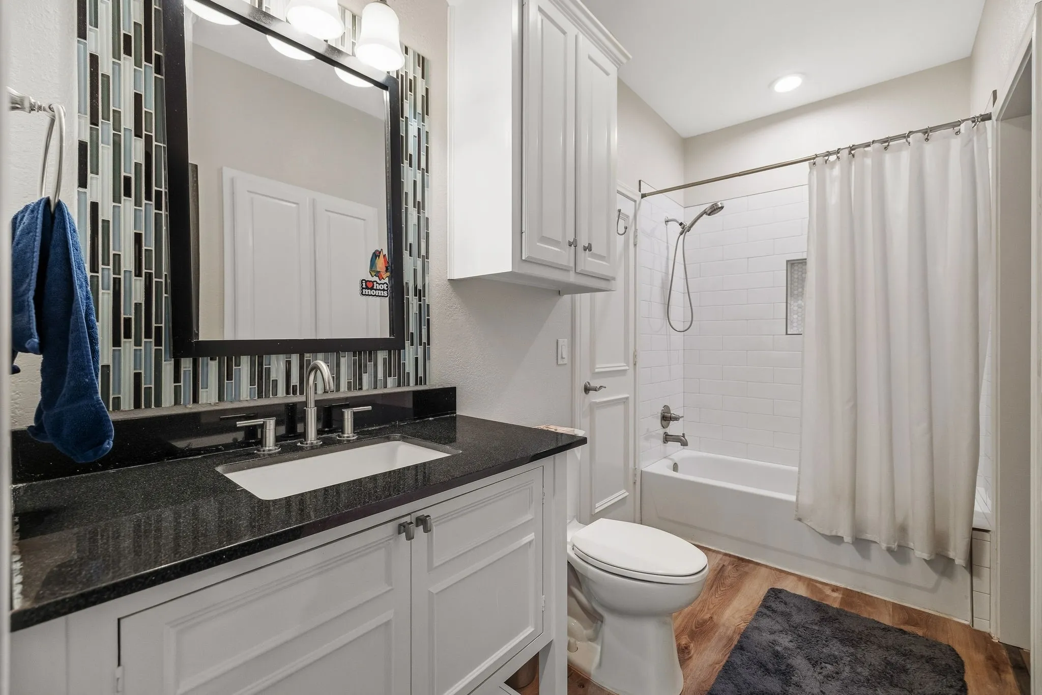 Updated full bathroom with access to secondary bedroom & media room.