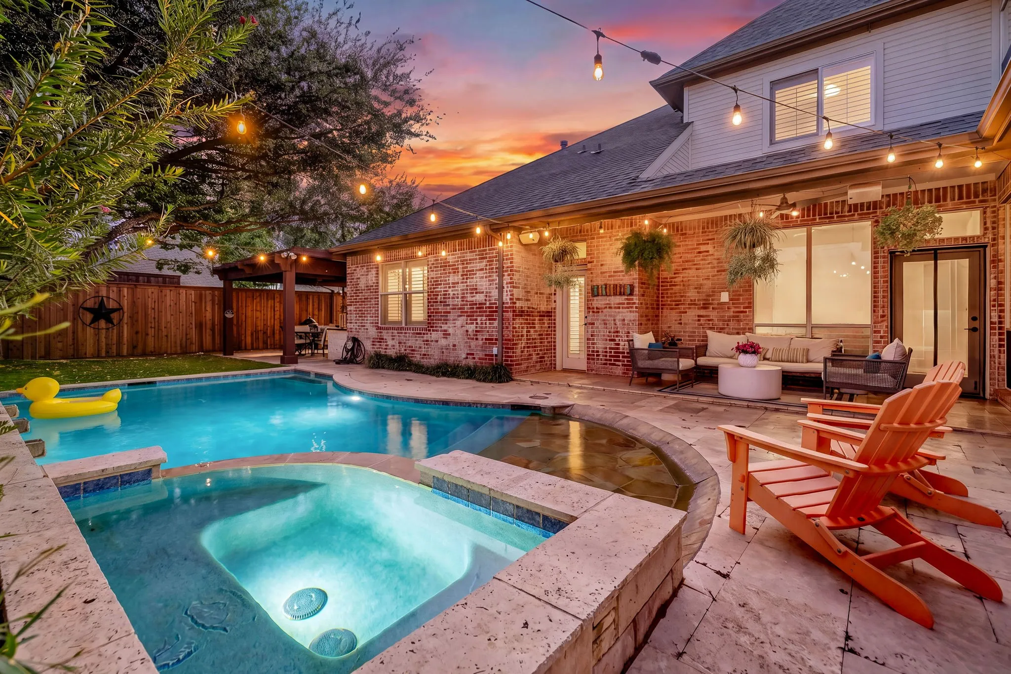 Sparkling pool with beach-entry & attached spa are the perfect place to lounge.