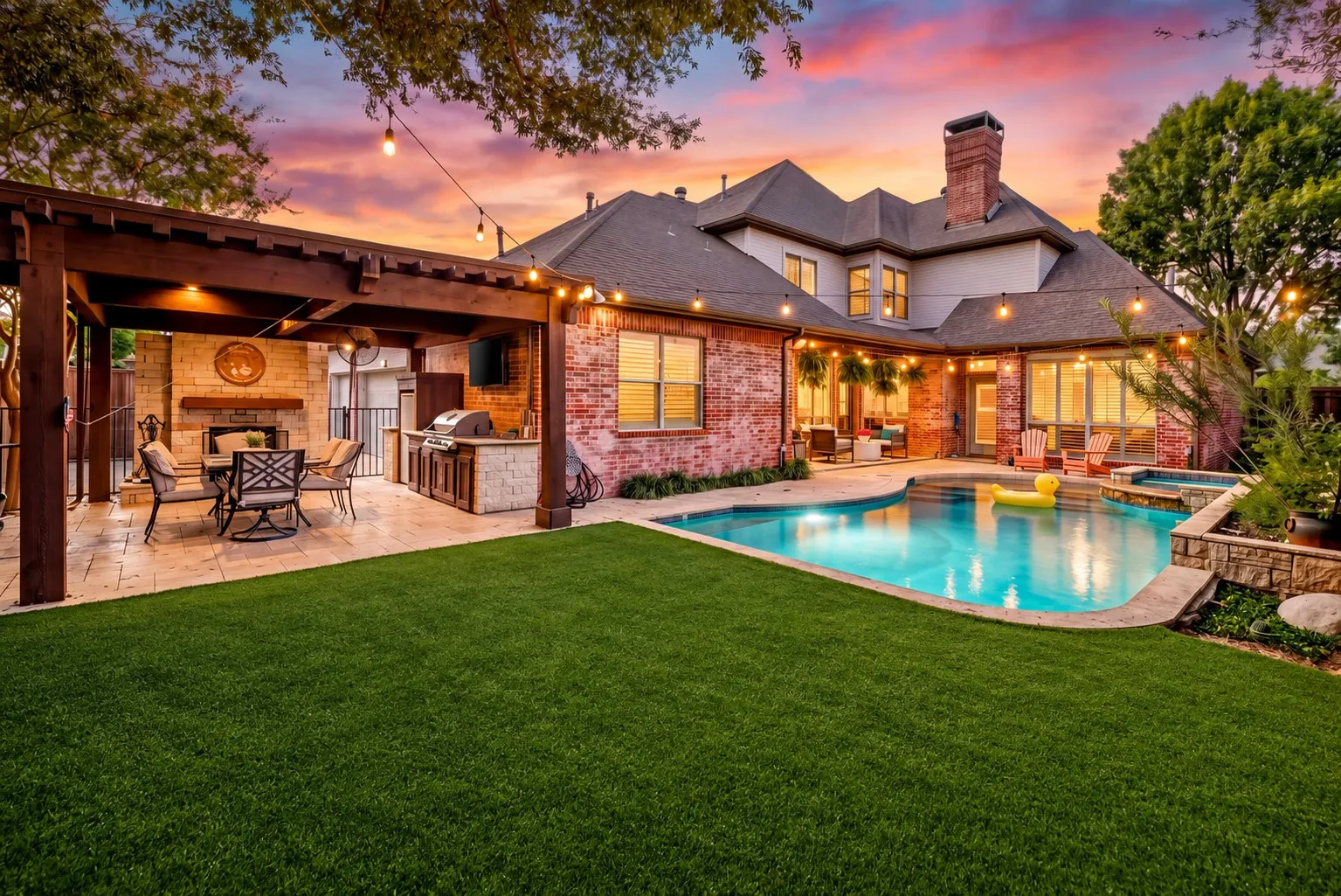 2026 artificial turf, sparkling pool, covered patio & outdoor living center.