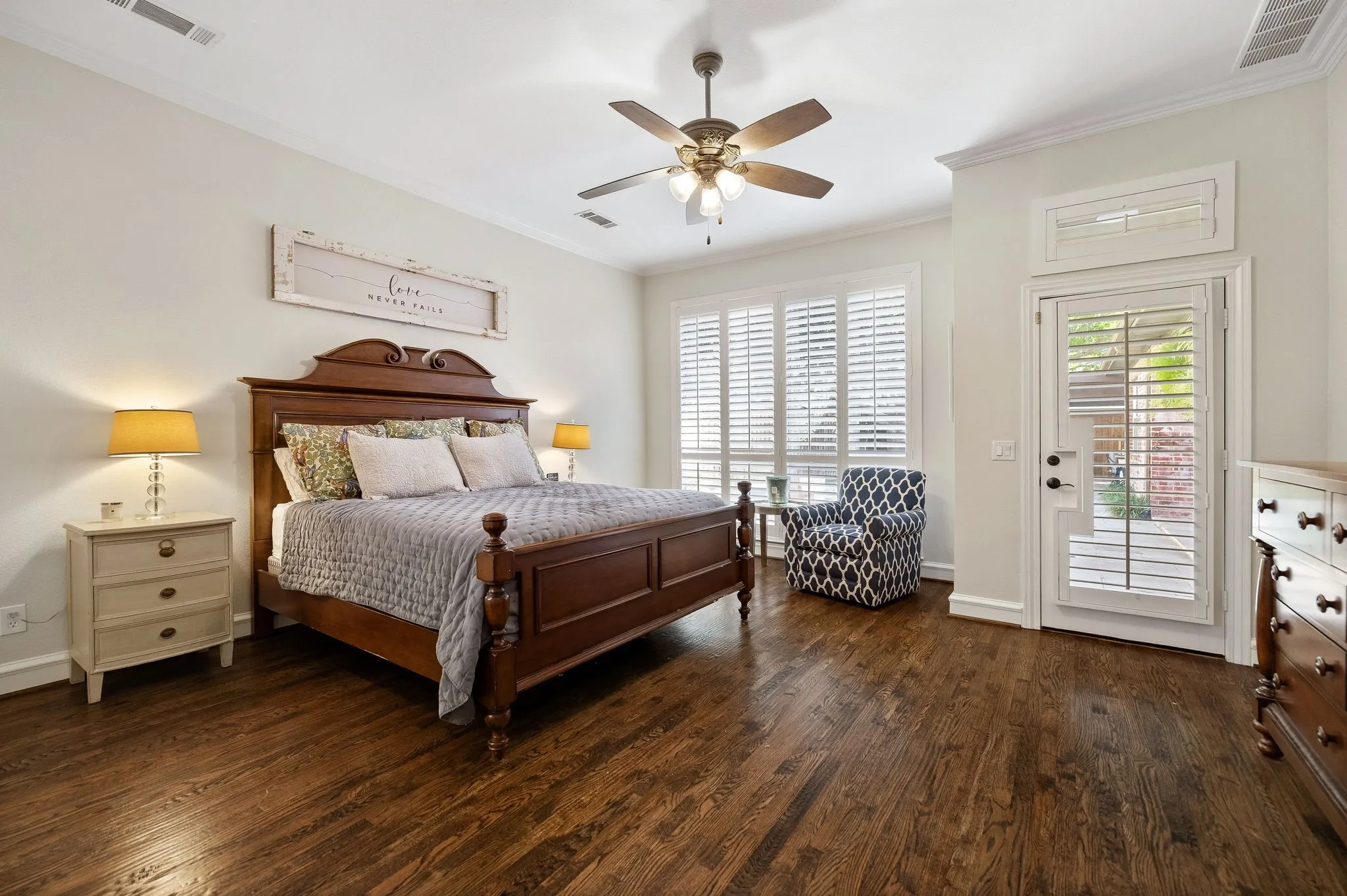 Primary suite with a door leading to the back patio & pool.