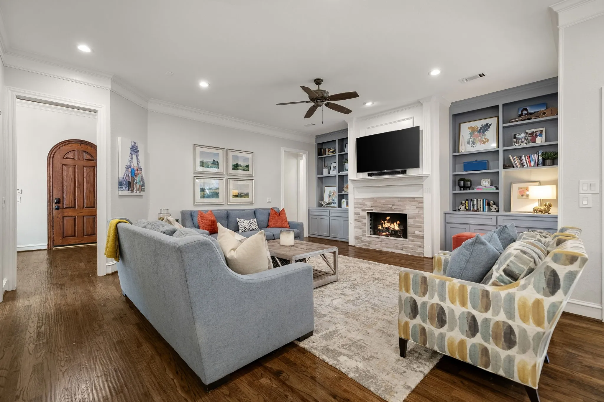 Hardwood flooring, recessed lighting, ceiling fan, custom cabinetry