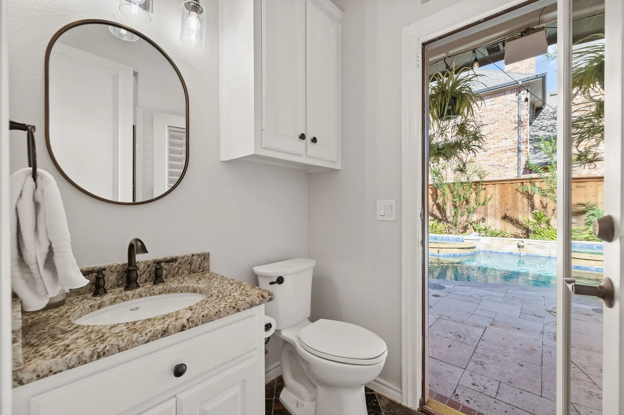 Full bathroom with a shower, and has separate door for pool access.