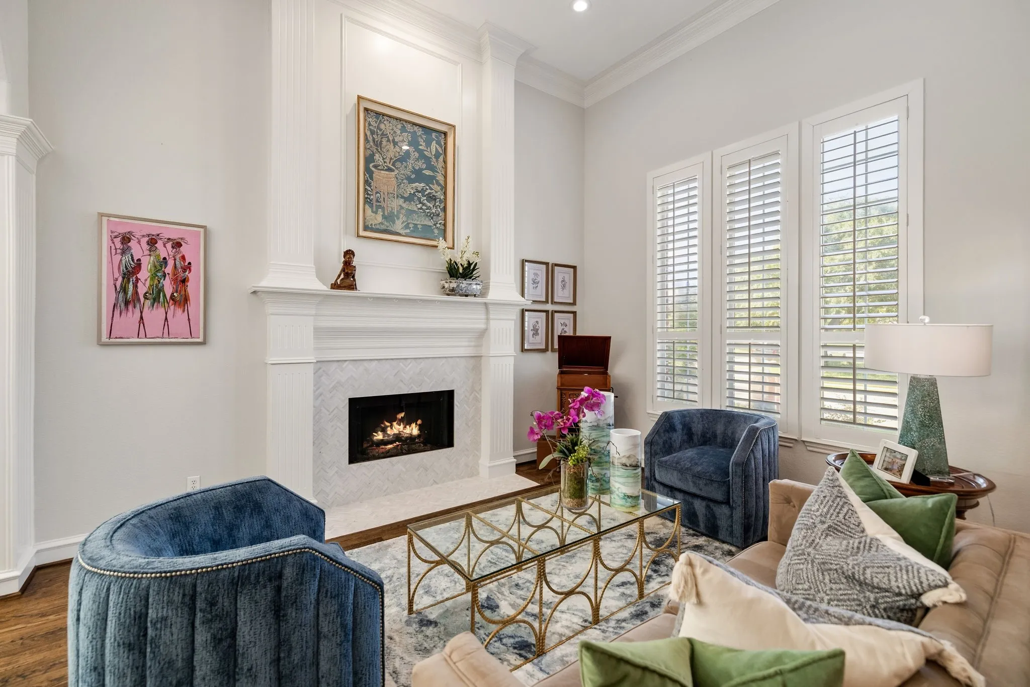 Harwood flooring, plantation shutters & remodeled fireplace