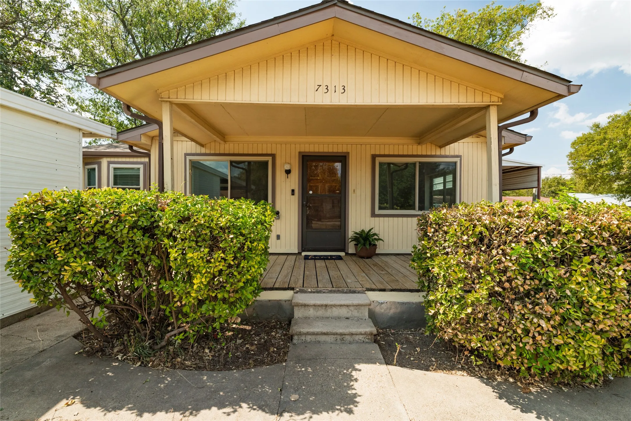 Covered front porch with wood flooring