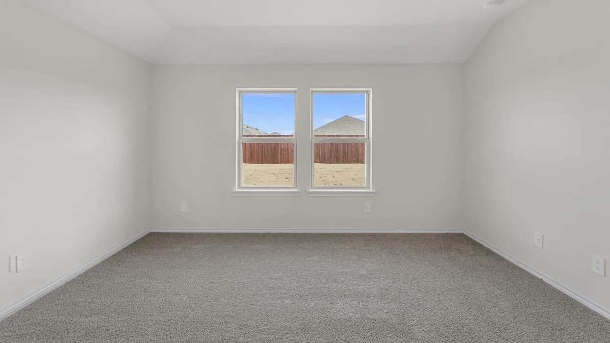 Neutral wall paint, plush carpeting, dual windows, and a sloped ceiling