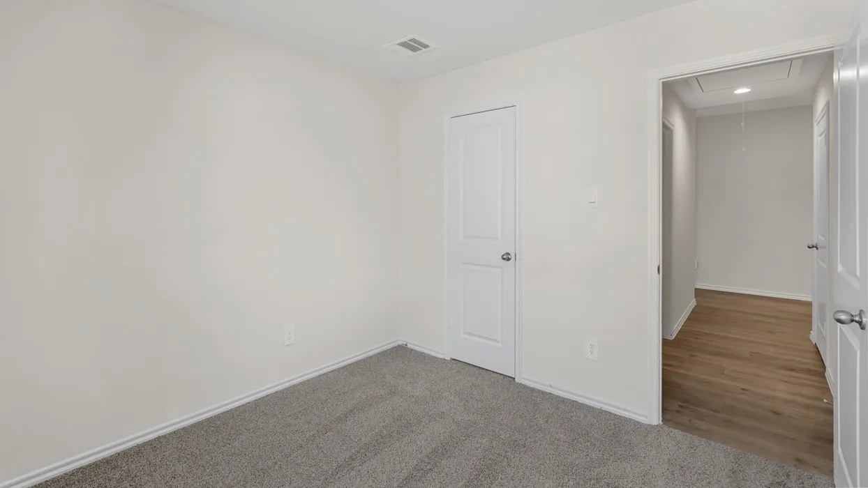 Room featuring light gray carpet flooring and white painted walls
