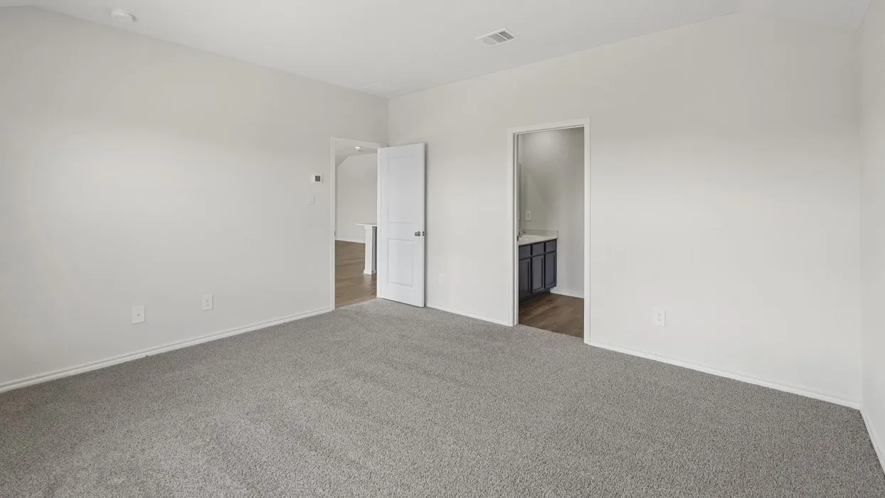 Spacious room featuring light gray carpeting, white painted walls, and white trim