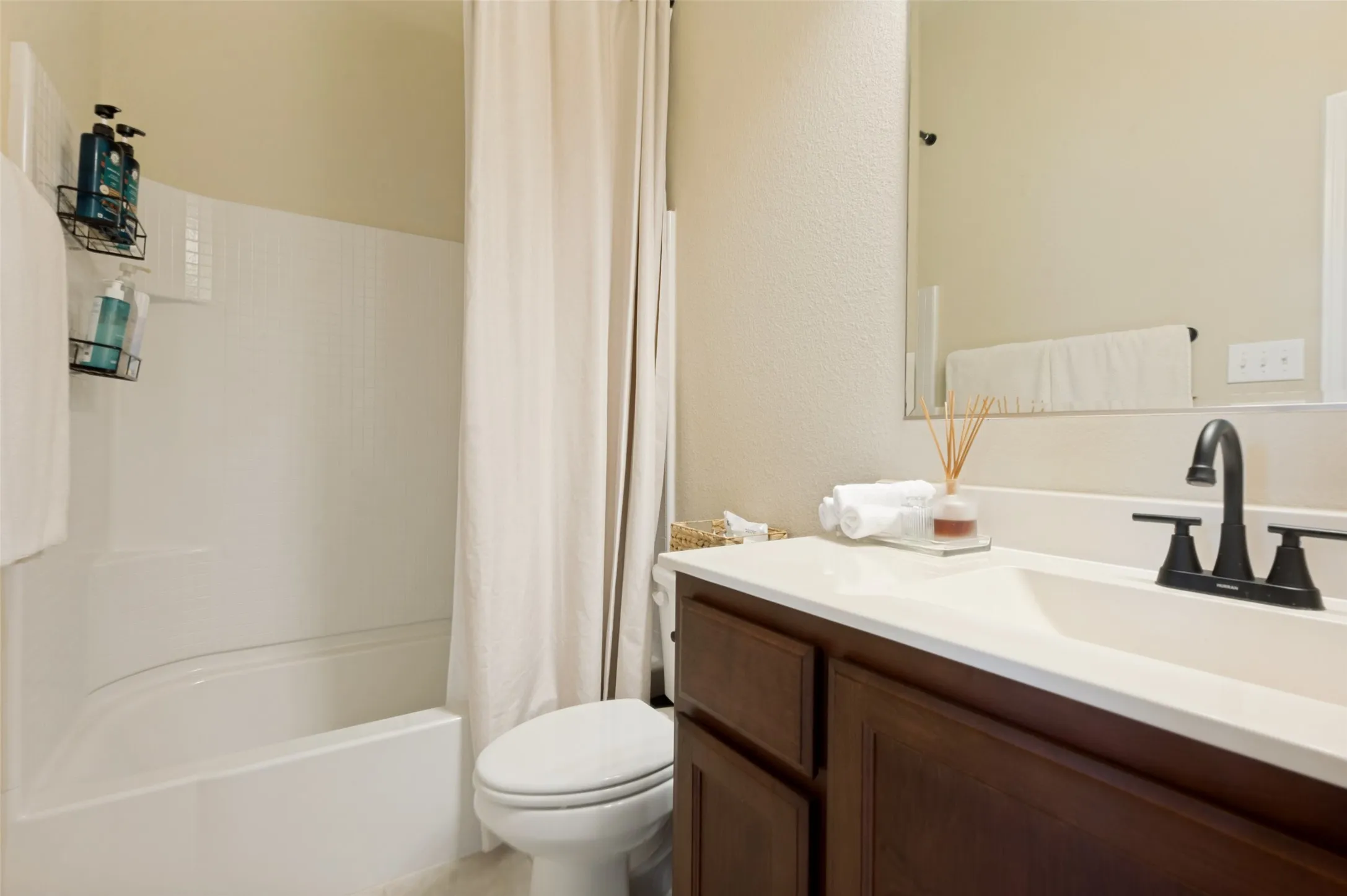 Tub and shower combination with white surround